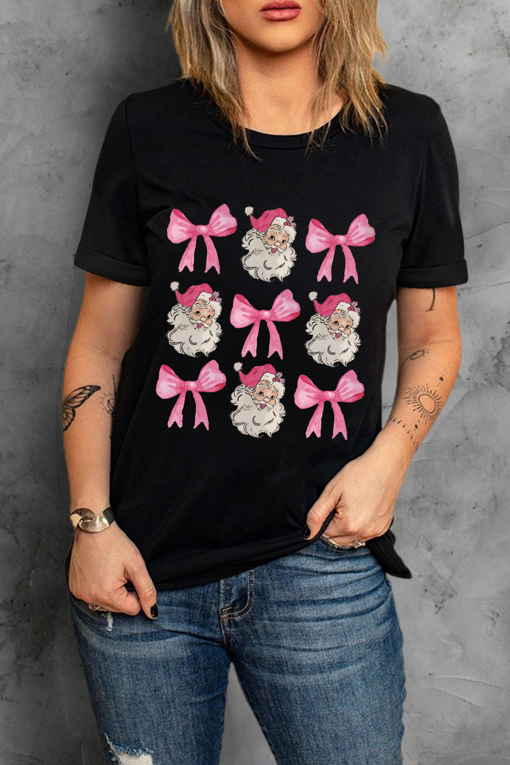 Get into the holiday spirit with this Women's Black Santa Claus Bow Knot Christmas Graphic Tee. The festive design features Santa Claus surrounded by bow knots, adding a playful touch to this casual tee. Made from a soft blend of 62% polyester, 32% cotton, and 6% elastane, this short-sleeved shirt is perfect for daily wear. The shift cut is easy to move around in, and the crew neck keeps you comfortable. Pair it with jeans or casual bottoms for a comfortable and stylish outfit. Graphic tees are a must-have for Christmas celebrations, and this one is sure to be a hit. - Detail View 4 Get into the holiday spirit with this Women's Black Santa Claus Bow Knot Christmas Graphic Tee. The festive design features Santa Claus surrounded by bow knots, adding a playful touch to this casual tee. Made from a soft blend of 62% polyester, 32% cotton, and 6% elastane, this short-sleeved shirt is perfect for daily wear. The shift cut is easy to move around in, and the crew neck keeps you comfortable. Pair it with jeans or casual bottoms for a comfortable and stylish outfit. Graphic tees are a must-have for Christmas celebrations, and this one is sure to be a hit. - Detail View 4