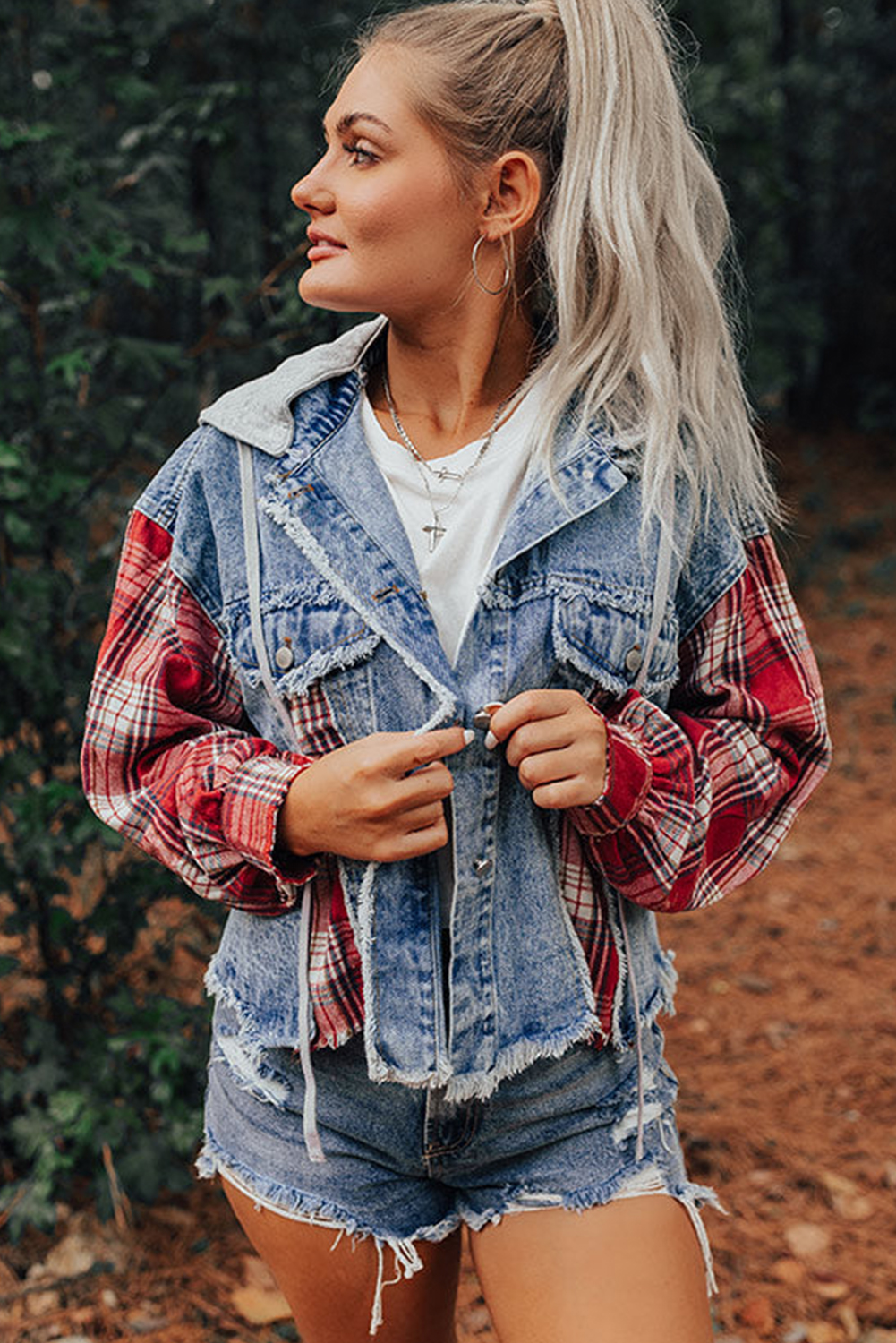Make a unique fashion statement with this Women's Beau Blue Plaid Patchwork Hooded Raw Hem Denim Jacket. Embrace a trendy and casual style with the plaid patchwork design that adds a touch of creativity to your outfit. The distressed raw hem details create a vintage look, exuding a laid-back and fashionable vibe. This hooded denim jacket, made from a premium blend of 83% cotton and 17% polyester, ensures both style and durability. Perfect for daily wear, this jacket pairs effortlessly with a t-shirt and jeans for a relaxed and stylish ensemble. Stand out from the crowd with this fashionable denim jacket that combines comfort and style in one versatile piece. - Detail View 4 Make a unique fashion statement with this Women's Beau Blue Plaid Patchwork Hooded Raw Hem Denim Jacket. Embrace a trendy and casual style with the plaid patchwork design that adds a touch of creativity to your outfit. The distressed raw hem details create a vintage look, exuding a laid-back and fashionable vibe. This hooded denim jacket, made from a premium blend of 83% cotton and 17% polyester, ensures both style and durability. Perfect for daily wear, this jacket pairs effortlessly with a t-shirt and jeans for a relaxed and stylish ensemble. Stand out from the crowd with this fashionable denim jacket that combines comfort and style in one versatile piece. - Detail View 4