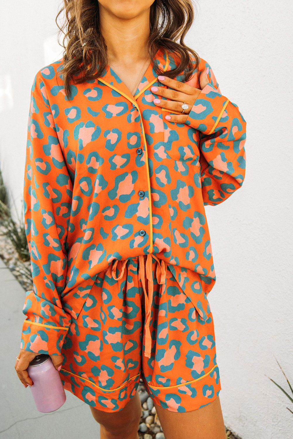 Sleep in Style: Orange Leopard Print Long Sleeve Pajama Set with High-Waist Shorts - Detail View 3 Sleep in Style: Orange Leopard Print Long Sleeve Pajama Set with High-Waist Shorts - Detail View 3