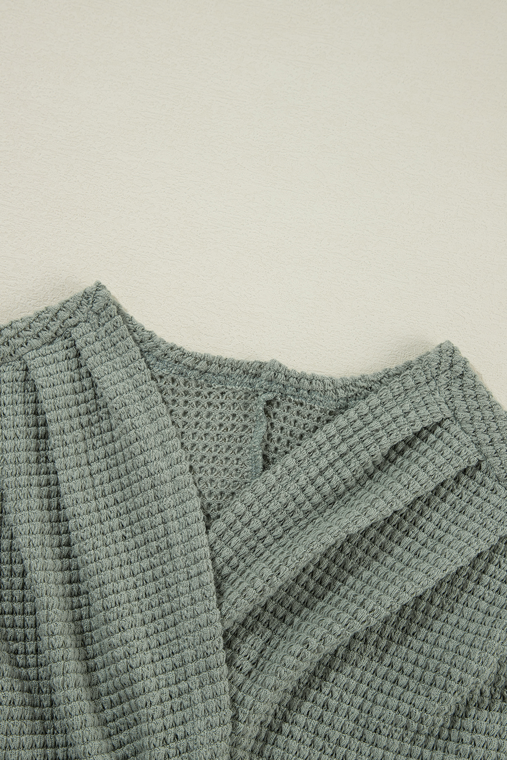 Stay cozy and stylish with this Women's Laurel Green Waffle Knit Open Front Cardigan. The soft waffle knit provides a cozy and textured look and feel, perfect for the fall and autumn seasons. The classic open front design offers versatile styling options, making it easy to layer over any outfit. The relaxed fit ensures comfort and ease of layering, while the timeless cardigan design is perfect for transitional seasons. Made from a premium blend of 95% polyester and 5% elastane, this cardigan offers durability and a comfortable fit. The Laurel Green color adds a touch of freshness to your wardrobe and effortlessly pairs with any outfit for warmth and style. With its long sleeves and convenient pockets, this cardigan is a must-have addition to your casual wardrobe. - Detail View 9 Stay cozy and stylish with this Women's Laurel Green Waffle Knit Open Front Cardigan. The soft waffle knit provides a cozy and textured look and feel, perfect for the fall and autumn seasons. The classic open front design offers versatile styling options, making it easy to layer over any outfit. The relaxed fit ensures comfort and ease of layering, while the timeless cardigan design is perfect for transitional seasons. Made from a premium blend of 95% polyester and 5% elastane, this cardigan offers durability and a comfortable fit. The Laurel Green color adds a touch of freshness to your wardrobe and effortlessly pairs with any outfit for warmth and style. With its long sleeves and convenient pockets, this cardigan is a must-have addition to your casual wardrobe. - Detail View 9
