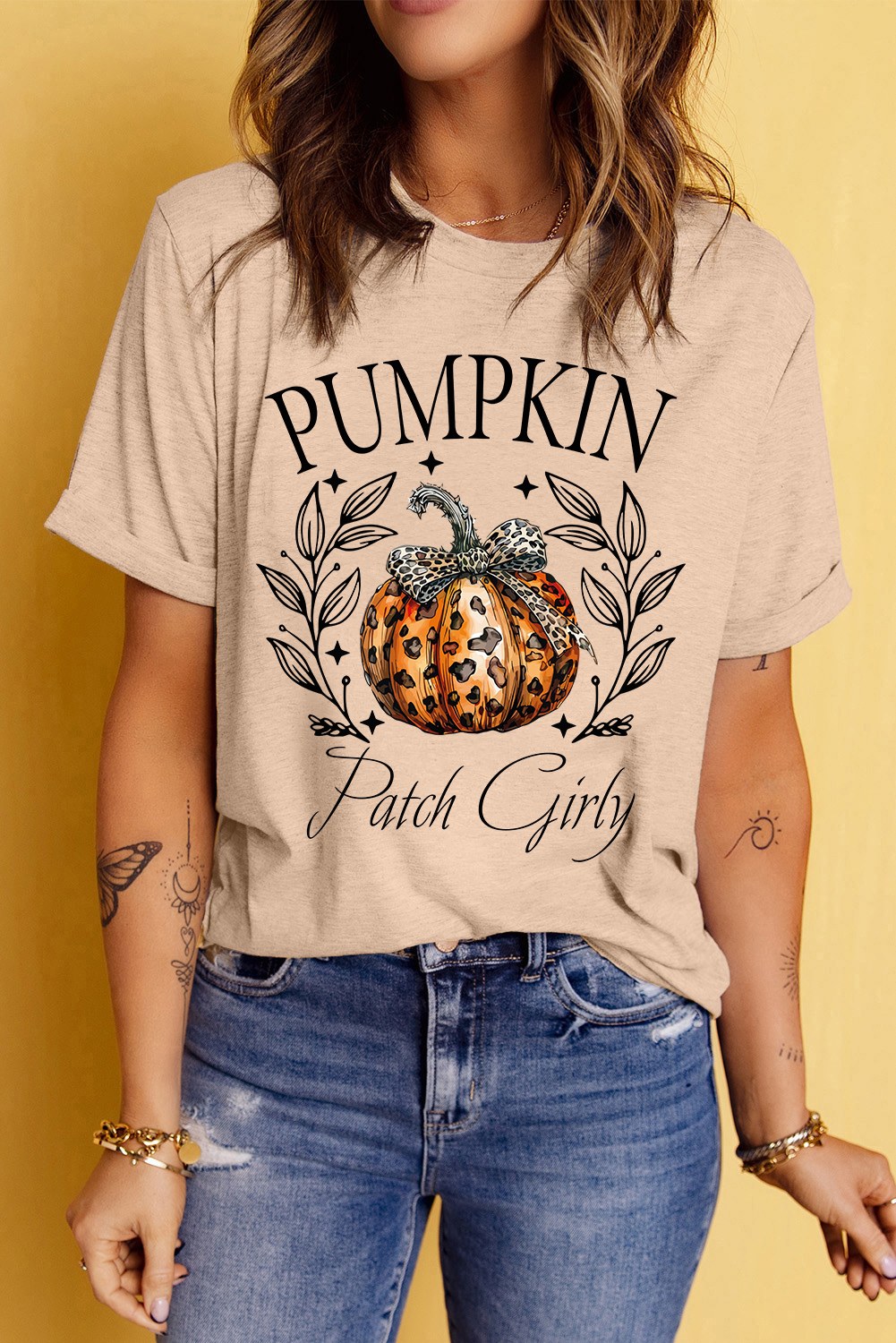 Get into the Halloween spirit with this Women's Festive Khaki Pumpkin Patch Girly Leopard Bowknot Graphic T-Shirt. The playful graphic tee features a fun slogan print that spreads the holiday spirit, making it an ideal choice for Halloween. The bowknot and leopard pumpkin patterns add a feminine and stylish touch to the tee, perfect for adding a touch of whimsy to your outfit. Pair it with jeans or skinny pants for a Halloween-ready ensemble that is both fun and fashionable. Made from a comfortable blend of 62% polyester, 32% cotton, and 6% elastane, this tee ensures a soft and breathable feel, making it suitable for daily wear. The round neck and short sleeves provide a classic and versatile silhouette, while the khaki color adds a subtle and trendy look to the tee. Embrace the holiday season with this festive and stylish graphic t-shirt. - Detail View 4 Get into the Halloween spirit with this Women's Festive Khaki Pumpkin Patch Girly Leopard Bowknot Graphic T-Shirt. The playful graphic tee features a fun slogan print that spreads the holiday spirit, making it an ideal choice for Halloween. The bowknot and leopard pumpkin patterns add a feminine and stylish touch to the tee, perfect for adding a touch of whimsy to your outfit. Pair it with jeans or skinny pants for a Halloween-ready ensemble that is both fun and fashionable. Made from a comfortable blend of 62% polyester, 32% cotton, and 6% elastane, this tee ensures a soft and breathable feel, making it suitable for daily wear. The round neck and short sleeves provide a classic and versatile silhouette, while the khaki color adds a subtle and trendy look to the tee. Embrace the holiday season with this festive and stylish graphic t-shirt. - Detail View 4
