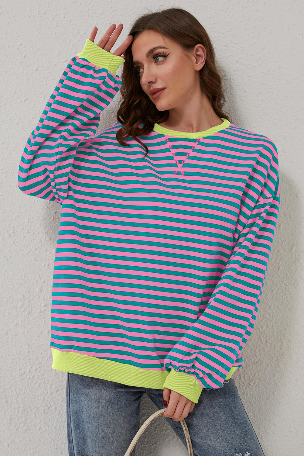 Stay stylish and comfortable with this Women's Oversized Green Stripe Contrast Trim Pullover Sweatshirt. The classic striped pattern and timeless design make it a must-have addition to your wardrobe. The oversized style and drop shoulder design give a slouchy, effortless vibe, perfect for casual daily wear. The contrast trim adds a pop of color and visual interest, making this sweatshirt stand out. The relaxed fit and comfort design make it suitable for different body shapes. Made from a blend of 95% cotton and 5% elastane, this sweatshirt ensures durability and breathability. Whether you're running errands or lounging around, this pullover sweatshirt is the perfect choice for a comfortable and stylish look. - Detail View 9 Stay stylish and comfortable with this Women's Oversized Green Stripe Contrast Trim Pullover Sweatshirt. The classic striped pattern and timeless design make it a must-have addition to your wardrobe. The oversized style and drop shoulder design give a slouchy, effortless vibe, perfect for casual daily wear. The contrast trim adds a pop of color and visual interest, making this sweatshirt stand out. The relaxed fit and comfort design make it suitable for different body shapes. Made from a blend of 95% cotton and 5% elastane, this sweatshirt ensures durability and breathability. Whether you're running errands or lounging around, this pullover sweatshirt is the perfect choice for a comfortable and stylish look. - Detail View 9