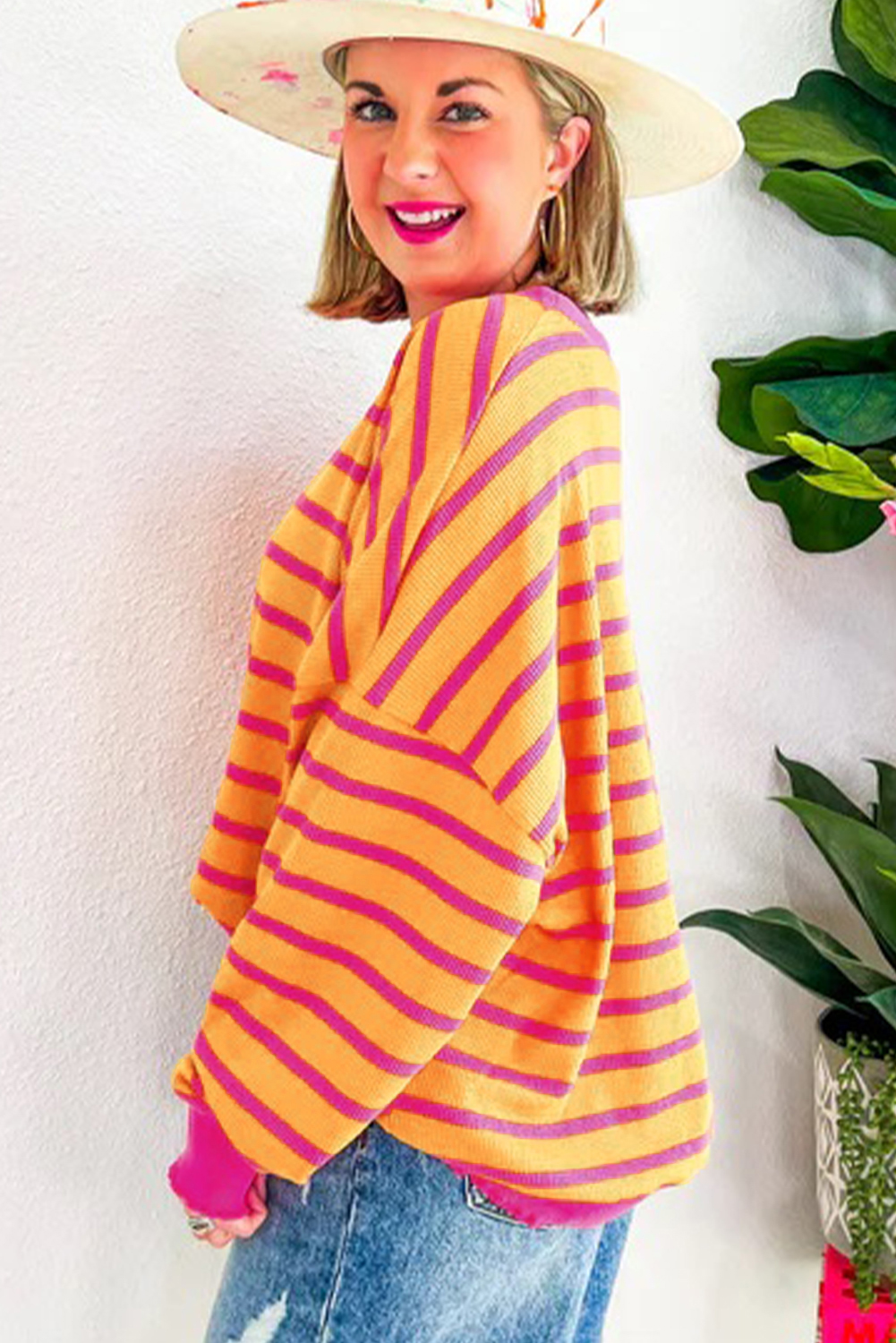Stay warm and stylish with this Women's Orange Striped Round Neck Drop Shoulder Loose Sweater. The classic striped pattern in orange and rose red adds a pop of color and style to this knit sweater. The relaxed fit and drop shoulder design provide a comfortable and laid-back feel, making it suitable for different body shapes and various occasions. Made from a blend of 50% viscose, 28% polyester, and 22% polyamide, this sweater offers both warmth and breathability. The long sleeves ensure extra coziness, perfect for the fall and autumn season. Pair it with your favorite jeans or leggings for a casual and chic look. This must-have sweater combines fashion and comfort, ideal for daily wear to keep you warm and stylish. - Detail View 4 Stay warm and stylish with this Women's Orange Striped Round Neck Drop Shoulder Loose Sweater. The classic striped pattern in orange and rose red adds a pop of color and style to this knit sweater. The relaxed fit and drop shoulder design provide a comfortable and laid-back feel, making it suitable for different body shapes and various occasions. Made from a blend of 50% viscose, 28% polyester, and 22% polyamide, this sweater offers both warmth and breathability. The long sleeves ensure extra coziness, perfect for the fall and autumn season. Pair it with your favorite jeans or leggings for a casual and chic look. This must-have sweater combines fashion and comfort, ideal for daily wear to keep you warm and stylish. - Detail View 4