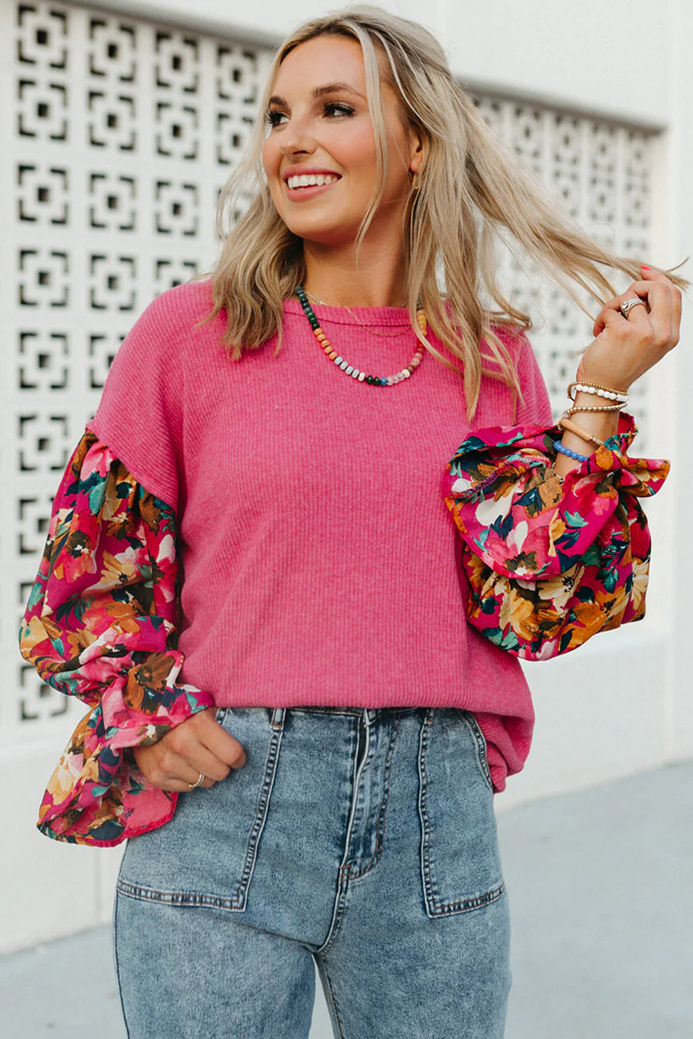 Add a touch of sophistication to your wardrobe with this Women's Sachet Pink Flower Patchwork Ruffled Sleeve Ribbed Knit Top. The trendy ruffled sleeves exude femininity and charm, while the relaxed drop shoulder style adds a casual vibe to the top. Made from a comfortable ribbed knit fabric blend of 55% polyester, 31% viscose, 12% polyamide, and 2% elastane, this blouse ensures all-day wear without compromising on style. The sophisticated patchwork design and floral print make it a standout piece for daily wear. The round neck adds a classic and timeless touch to the top, making it easy to pair with any bottoms. This country-style blouse is perfect for adding a touch of elegance to your winter wardrobe. - Detail View 4 Add a touch of sophistication to your wardrobe with this Women's Sachet Pink Flower Patchwork Ruffled Sleeve Ribbed Knit Top. The trendy ruffled sleeves exude femininity and charm, while the relaxed drop shoulder style adds a casual vibe to the top. Made from a comfortable ribbed knit fabric blend of 55% polyester, 31% viscose, 12% polyamide, and 2% elastane, this blouse ensures all-day wear without compromising on style. The sophisticated patchwork design and floral print make it a standout piece for daily wear. The round neck adds a classic and timeless touch to the top, making it easy to pair with any bottoms. This country-style blouse is perfect for adding a touch of elegance to your winter wardrobe. - Detail View 4