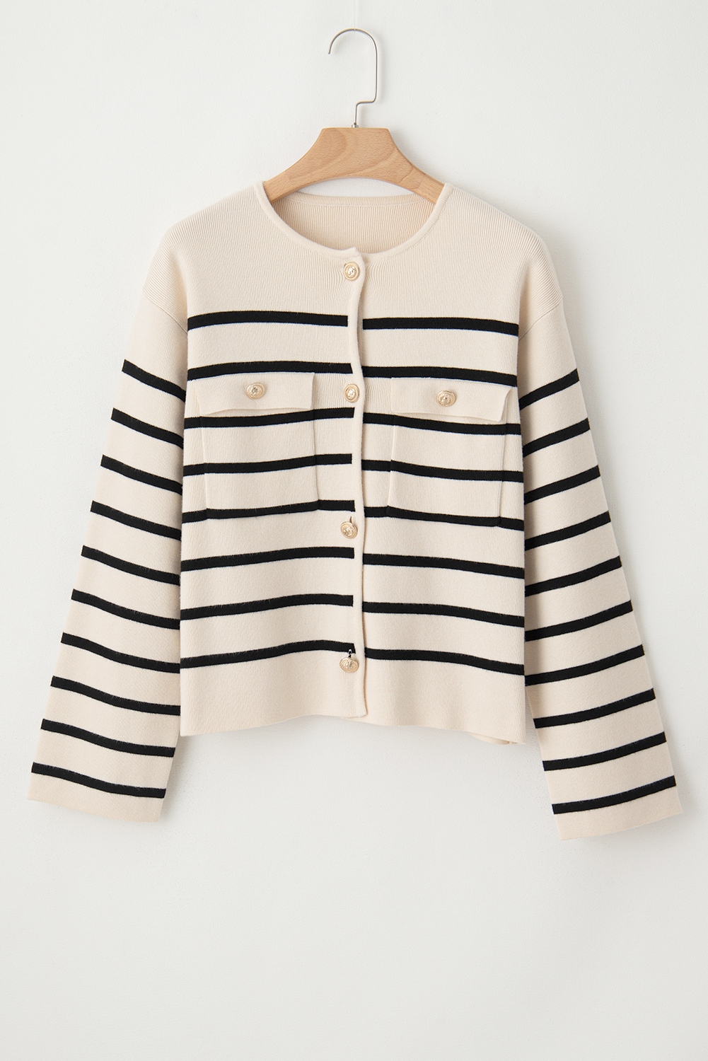 Make a statement with this Women's Classic Black Stripe Flap Pocket Buttoned Cardigan Sweater. The classic striped pattern adds a timeless touch, while the flap pockets provide both style and functionality. The buttoned front allows for easy fastening and an adjustable fit, making it perfect for ladies of all ages. Pair it with your favorite pants or skirts for a chic and elegant look. This cardigan is a must-have addition to your winter wardrobe, offering both modernity and timelessness. - Detail View 14 Make a statement with this Women's Classic Black Stripe Flap Pocket Buttoned Cardigan Sweater. The classic striped pattern adds a timeless touch, while the flap pockets provide both style and functionality. The buttoned front allows for easy fastening and an adjustable fit, making it perfect for ladies of all ages. Pair it with your favorite pants or skirts for a chic and elegant look. This cardigan is a must-have addition to your winter wardrobe, offering both modernity and timelessness. - Detail View 14