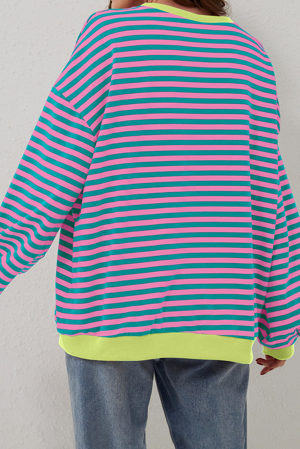 Stay stylish and comfortable with this Women's Oversized Green Stripe Contrast Trim Pullover Sweatshirt. The classic striped pattern and timeless design make it a must-have addition to your wardrobe. The oversized style and drop shoulder design give a slouchy, effortless vibe, perfect for casual daily wear. The contrast trim adds a pop of color and visual interest, making this sweatshirt stand out. The relaxed fit and comfort design make it suitable for different body shapes. Made from a blend of 95% cotton and 5% elastane, this sweatshirt ensures durability and breathability. Whether you're running errands or lounging around, this pullover sweatshirt is the perfect choice for a comfortable and stylish look. - Detail View 4 Stay stylish and comfortable with this Women's Oversized Green Stripe Contrast Trim Pullover Sweatshirt. The classic striped pattern and timeless design make it a must-have addition to your wardrobe. The oversized style and drop shoulder design give a slouchy, effortless vibe, perfect for casual daily wear. The contrast trim adds a pop of color and visual interest, making this sweatshirt stand out. The relaxed fit and comfort design make it suitable for different body shapes. Made from a blend of 95% cotton and 5% elastane, this sweatshirt ensures durability and breathability. Whether you're running errands or lounging around, this pullover sweatshirt is the perfect choice for a comfortable and stylish look. - Detail View 4