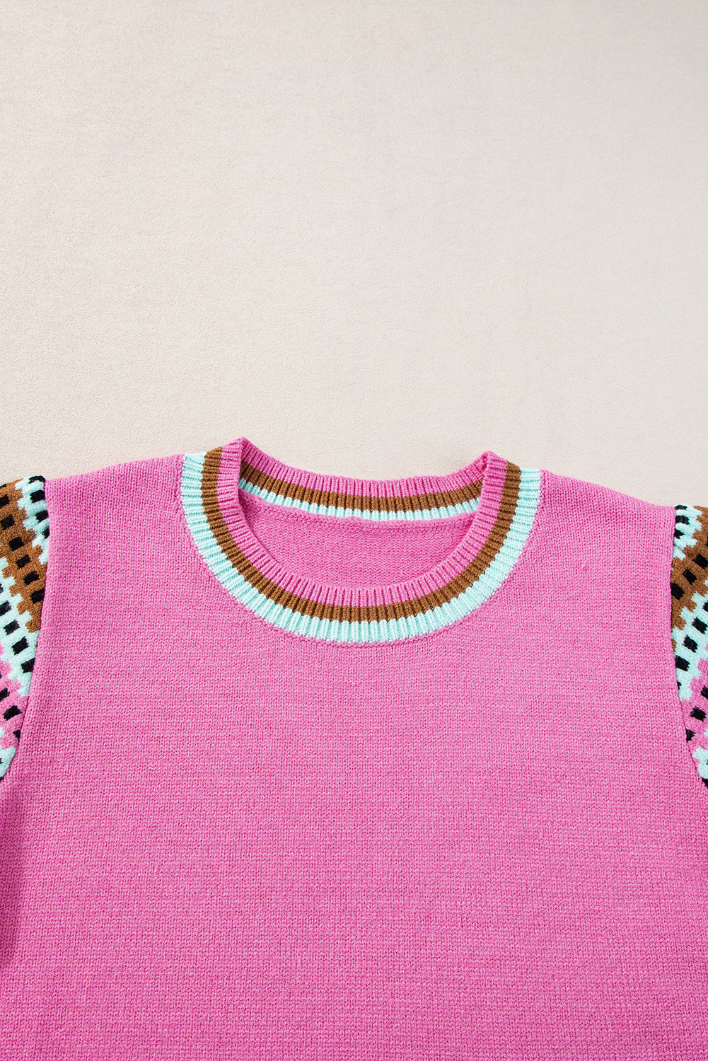Stay cozy and stylish with this Women's Bright Pink Short Sleeve Colorblock Crewneck Sweater. This fun and playful sweater features a colorblock design on the sleeves, adding a bold and contrasting touch to your outfit. The crew neck design makes this sweater a classic and timeless choice, perfect for casual or elegant occasions. Pair it with denim jeans for a relaxed look or with a skirt for a more polished ensemble. Made from high-quality 50% viscose, 28% polyester, and 22% polyamide blend, this sweater ensures durability and softness. The short sleeve design keeps you cool and comfortable, making it perfect for spring and summer wear. You'll love the vibrant bright pink color and the versatile style that pairs well with anything. Treat yourself or gift it to a friend with our bulk discounts. - Detail View 9 Stay cozy and stylish with this Women's Bright Pink Short Sleeve Colorblock Crewneck Sweater. This fun and playful sweater features a colorblock design on the sleeves, adding a bold and contrasting touch to your outfit. The crew neck design makes this sweater a classic and timeless choice, perfect for casual or elegant occasions. Pair it with denim jeans for a relaxed look or with a skirt for a more polished ensemble. Made from high-quality 50% viscose, 28% polyester, and 22% polyamide blend, this sweater ensures durability and softness. The short sleeve design keeps you cool and comfortable, making it perfect for spring and summer wear. You'll love the vibrant bright pink color and the versatile style that pairs well with anything. Treat yourself or gift it to a friend with our bulk discounts. - Detail View 9