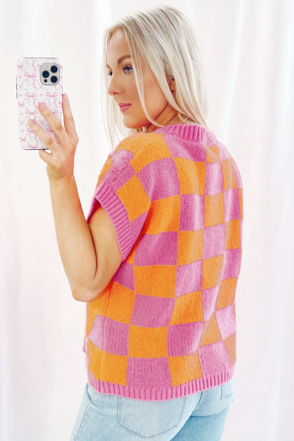 Add a touch of sophistication and modern twist to your summer wardrobe with this Strawberry Pink Colorblock Plaid Pattern Ribbed Trim Sweater Tank Top. The sleeveless design keeps you cool and comfortable, while the classic crew neck provides a timeless and flattering neckline. The stunning colorblock and plaid pattern combination adds a stylish touch to this versatile tank top. Made from a soft blend of 50% viscose, 28% polyester, and 22% polyamide, this sweater vest is both comfortable and durable. Perfect for daily wear, it can be easily paired with jeans, shorts, or a flowy skirt for a chic summer look. Experiment with different styles and discover the countless options this versatile sweater has to offer. - Detail View 4 Add a touch of sophistication and modern twist to your summer wardrobe with this Strawberry Pink Colorblock Plaid Pattern Ribbed Trim Sweater Tank Top. The sleeveless design keeps you cool and comfortable, while the classic crew neck provides a timeless and flattering neckline. The stunning colorblock and plaid pattern combination adds a stylish touch to this versatile tank top. Made from a soft blend of 50% viscose, 28% polyester, and 22% polyamide, this sweater vest is both comfortable and durable. Perfect for daily wear, it can be easily paired with jeans, shorts, or a flowy skirt for a chic summer look. Experiment with different styles and discover the countless options this versatile sweater has to offer. - Detail View 4