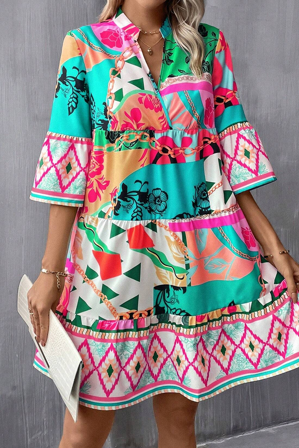 Stay fashionable and make a statement with this Multicoloured Abstract Printed Half Sleeve Notched Neck mini dress. The stylish abstract print design shines with a trendy, head-turning look while the flattering half sleeves provide added coverage for transitional seasons. The notched neckline is both elegant and fashionable, attracting attention in all the right ways. This mini dress is designed to show off its wearer's chic legs with a mini length finished silhouette, making it ideal for various occasions. The pocket and ruched details add a touch of flair to the dress while its natural waistline accentuates a feminine shape. Perfect for daily casual styles with a touch of sophistication, this multicoloured mini dress is a chic addition to any wardrobe. - Detail View 4 Stay fashionable and make a statement with this Multicoloured Abstract Printed Half Sleeve Notched Neck mini dress. The stylish abstract print design shines with a trendy, head-turning look while the flattering half sleeves provide added coverage for transitional seasons. The notched neckline is both elegant and fashionable, attracting attention in all the right ways. This mini dress is designed to show off its wearer's chic legs with a mini length finished silhouette, making it ideal for various occasions. The pocket and ruched details add a touch of flair to the dress while its natural waistline accentuates a feminine shape. Perfect for daily casual styles with a touch of sophistication, this multicoloured mini dress is a chic addition to any wardrobe. - Detail View 4