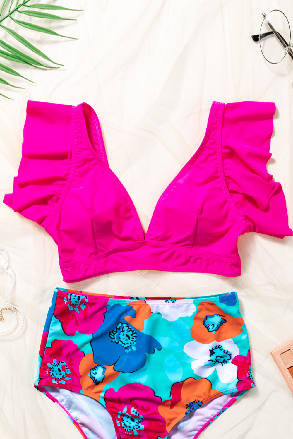 Elevate your beach look with this stunning Women's Rose Red Ruffled V-Neck Swim Top. The deep V neckline accentuates the bust shape and adds a touch of seductive charm to your swimwear ensemble. The sweet and graceful ruffled shoulder design exudes feminine elegance, making it an ideal choice for your beach vacation. The adjustable cup pads ensure a customized fit, while the wire-free support provides comfort and freedom of movement. Made from 85% polyester and 15% elastane, this swim top offers a perfect blend of flexibility and durability. Its solid rose red color adds a vibrant and eye-catching element to your summer wardrobe. Pair it with our swim shorts for a complete and chic beach look. Discover the allure of this ruffled V-neck swim top and make a stylish statement by the water. - Detail View 9 Elevate your beach look with this stunning Women's Rose Red Ruffled V-Neck Swim Top. The deep V neckline accentuates the bust shape and adds a touch of seductive charm to your swimwear ensemble. The sweet and graceful ruffled shoulder design exudes feminine elegance, making it an ideal choice for your beach vacation. The adjustable cup pads ensure a customized fit, while the wire-free support provides comfort and freedom of movement. Made from 85% polyester and 15% elastane, this swim top offers a perfect blend of flexibility and durability. Its solid rose red color adds a vibrant and eye-catching element to your summer wardrobe. Pair it with our swim shorts for a complete and chic beach look. Discover the allure of this ruffled V-neck swim top and make a stylish statement by the water. - Detail View 9