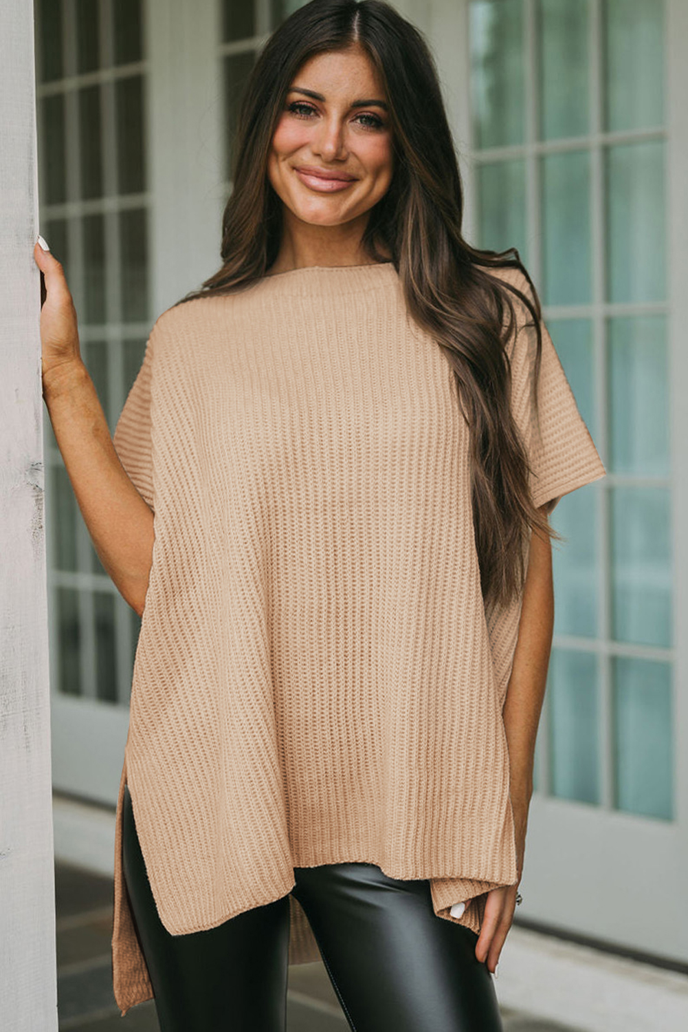 Elevate your style with this effortlessly chic Women's Apricot Short Sleeve Side Slit Oversized Sweater. The loose fit style offers a cozy and versatile look, perfect for daily wear. The wide short sleeves add a cool and modern touch to the sweater, while the tunic length provides a flattering silhouette. The side slits design adds unique detailing that will make you fall in love with this sweater. Made from a blend of 55% acrylic and 45% cotton, this sweater is comfortable and durable, making it an ideal choice for the fall and autumn seasons. Stay on-trend with the latest styles in women's sweaters, and add this modern and best-selling piece to your wardrobe. - Detail View 4 Elevate your style with this effortlessly chic Women's Apricot Short Sleeve Side Slit Oversized Sweater. The loose fit style offers a cozy and versatile look, perfect for daily wear. The wide short sleeves add a cool and modern touch to the sweater, while the tunic length provides a flattering silhouette. The side slits design adds unique detailing that will make you fall in love with this sweater. Made from a blend of 55% acrylic and 45% cotton, this sweater is comfortable and durable, making it an ideal choice for the fall and autumn seasons. Stay on-trend with the latest styles in women's sweaters, and add this modern and best-selling piece to your wardrobe. - Detail View 4