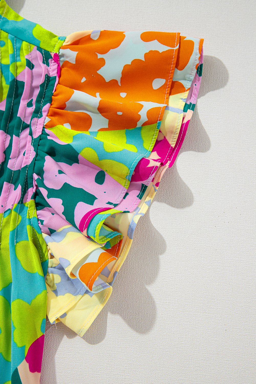 Feminine and Stylish Abstract Print Blouse with Flutter Sleeves - Detail View 7 Feminine and Stylish Abstract Print Blouse with Flutter Sleeves - Detail View 7