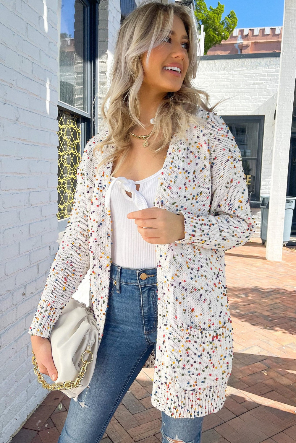 Add a touch of playful charm to your wardrobe with this Women's White Multicolor Dotted Rib Knit Long Sleeve Cardigan. The cardigan features a vibrant and colorful dot pattern, paired with a cozy rib knit for a comfortable and warm fit. The open front design makes it easy to layer over a tank top and jeans for a chic and trendy ensemble. Whether you're dressing up or down, this cardigan is sure to add a pop of fun to your outfit. Made from a soft and durable blend of 37% polyester, 35% acrylic, and 28% cotton, this cardigan is a must-have for your winter wardrobe. Perfect for daily wear, it's a great addition to any fashion-conscious woman's closet. - Detail View 9 Add a touch of playful charm to your wardrobe with this Women's White Multicolor Dotted Rib Knit Long Sleeve Cardigan. The cardigan features a vibrant and colorful dot pattern, paired with a cozy rib knit for a comfortable and warm fit. The open front design makes it easy to layer over a tank top and jeans for a chic and trendy ensemble. Whether you're dressing up or down, this cardigan is sure to add a pop of fun to your outfit. Made from a soft and durable blend of 37% polyester, 35% acrylic, and 28% cotton, this cardigan is a must-have for your winter wardrobe. Perfect for daily wear, it's a great addition to any fashion-conscious woman's closet. - Detail View 9