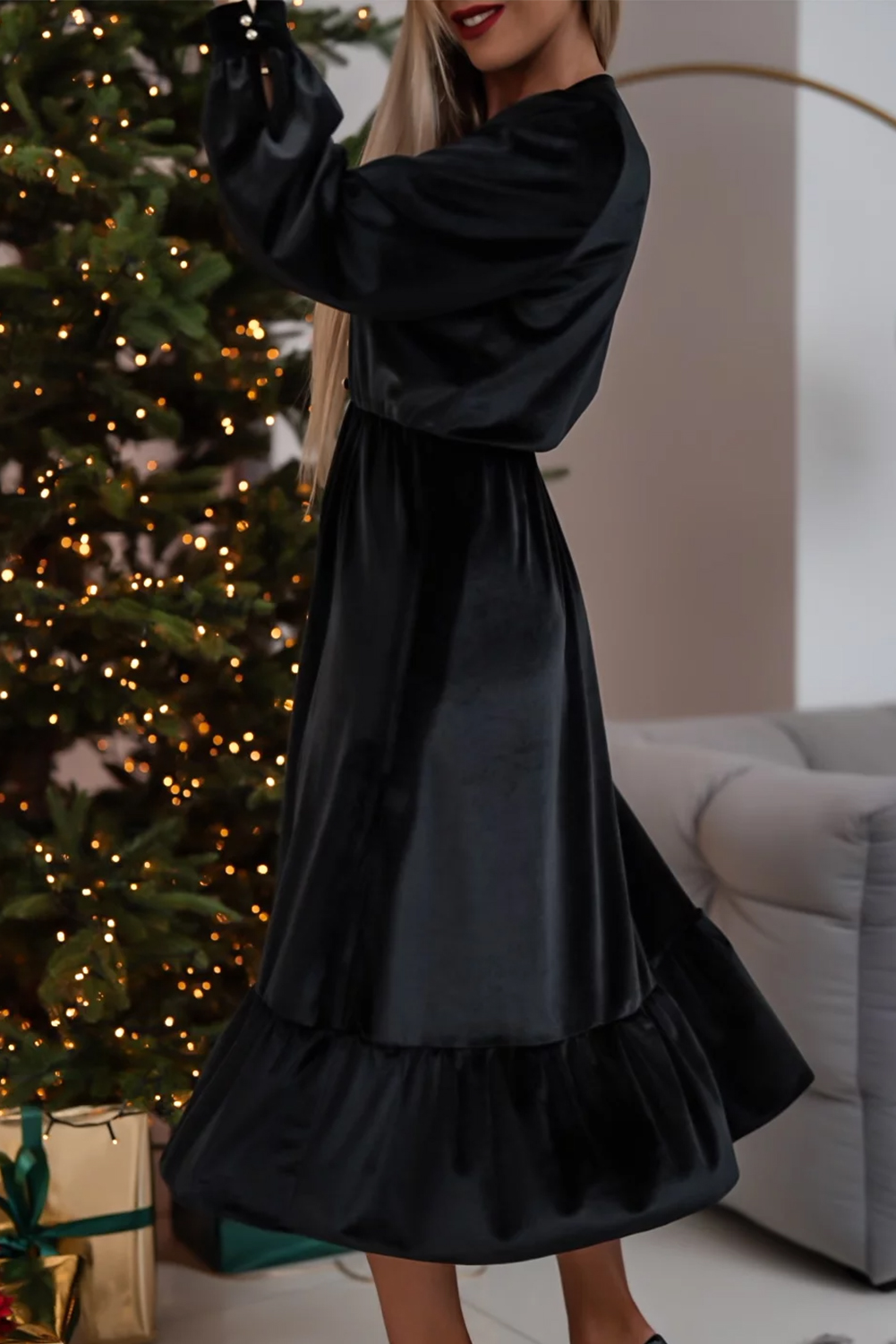 Make a statement with this Women's Elegant Black Velvet Long Sleeve V Neck Split Midi Dress. The luxurious velvet fabric provides a sophisticated look, while the elegant V neckline with button detailing exudes refinement. The stylish puff sleeves add a trendy touch, while the delicate ruffled hemline and flattering split create a feminine finish. Perfect for formal and semi-formal occasions, this midi dress is ideal for a night out or a special date. The high-waisted silhouette ensures a comfortable fit, and the long sleeves provide coverage and warmth. With its solid black color and elegant design, this dress is a must-have for your formal wardrobe. - Detail View 4 Make a statement with this Women's Elegant Black Velvet Long Sleeve V Neck Split Midi Dress. The luxurious velvet fabric provides a sophisticated look, while the elegant V neckline with button detailing exudes refinement. The stylish puff sleeves add a trendy touch, while the delicate ruffled hemline and flattering split create a feminine finish. Perfect for formal and semi-formal occasions, this midi dress is ideal for a night out or a special date. The high-waisted silhouette ensures a comfortable fit, and the long sleeves provide coverage and warmth. With its solid black color and elegant design, this dress is a must-have for your formal wardrobe. - Detail View 4