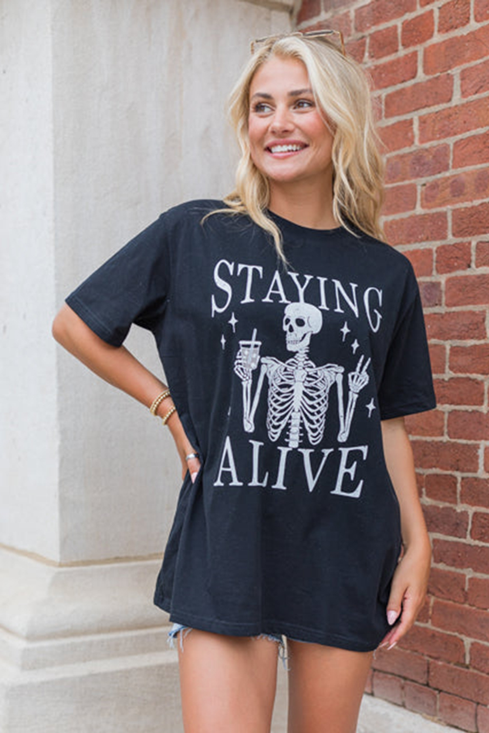 Quirky Halloween Tee: STAYING ALIVE Slogan with Skeleton Print - Detail View 7 Quirky Halloween Tee: STAYING ALIVE Slogan with Skeleton Print - Detail View 7