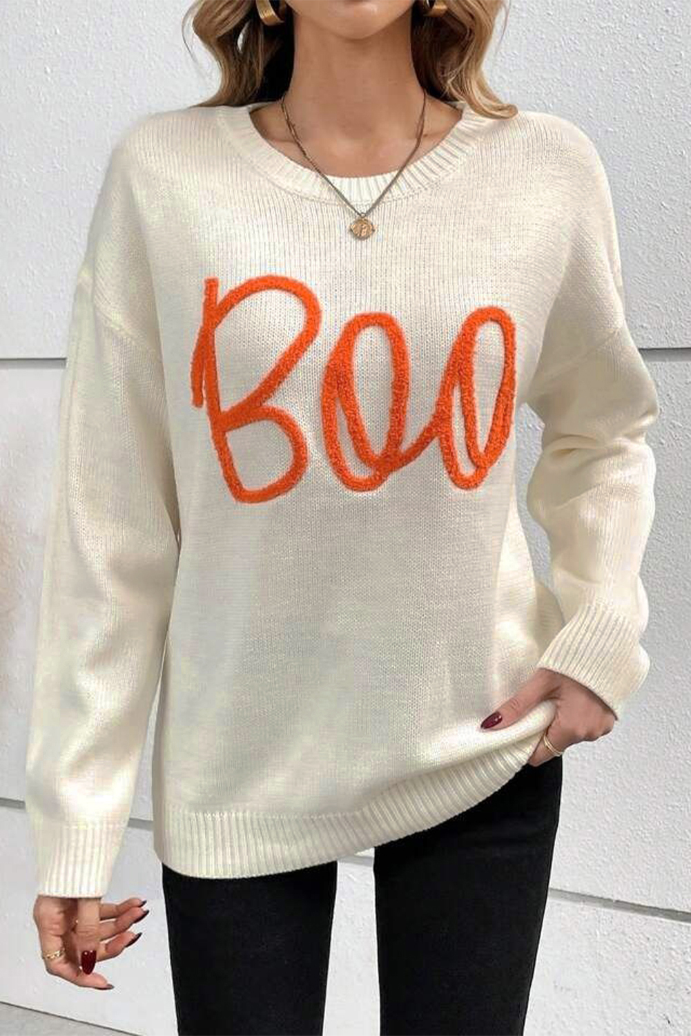 Stay warm and stylish this fall with this Women's Apricot Boo Knitted Pattern Long Sleeve Drop Shoulder Sweater. The loose fit and relaxed design make it perfect for casual wear, while the playful letter pattern adds a fun and trendy touch. The ribbed edge detailing adds texture and interest to the sweater, while the classic crew neck design provides a versatile and timeless look. Made from a blend of 50% viscose, 28% polyester, and 22% polyamide, this sweater strikes the perfect balance between chic and casual. Pair it with jeans, leggings, or shorts for a cozy and effortless outfit. - Detail View 4 Stay warm and stylish this fall with this Women's Apricot Boo Knitted Pattern Long Sleeve Drop Shoulder Sweater. The loose fit and relaxed design make it perfect for casual wear, while the playful letter pattern adds a fun and trendy touch. The ribbed edge detailing adds texture and interest to the sweater, while the classic crew neck design provides a versatile and timeless look. Made from a blend of 50% viscose, 28% polyester, and 22% polyamide, this sweater strikes the perfect balance between chic and casual. Pair it with jeans, leggings, or shorts for a cozy and effortless outfit. - Detail View 4