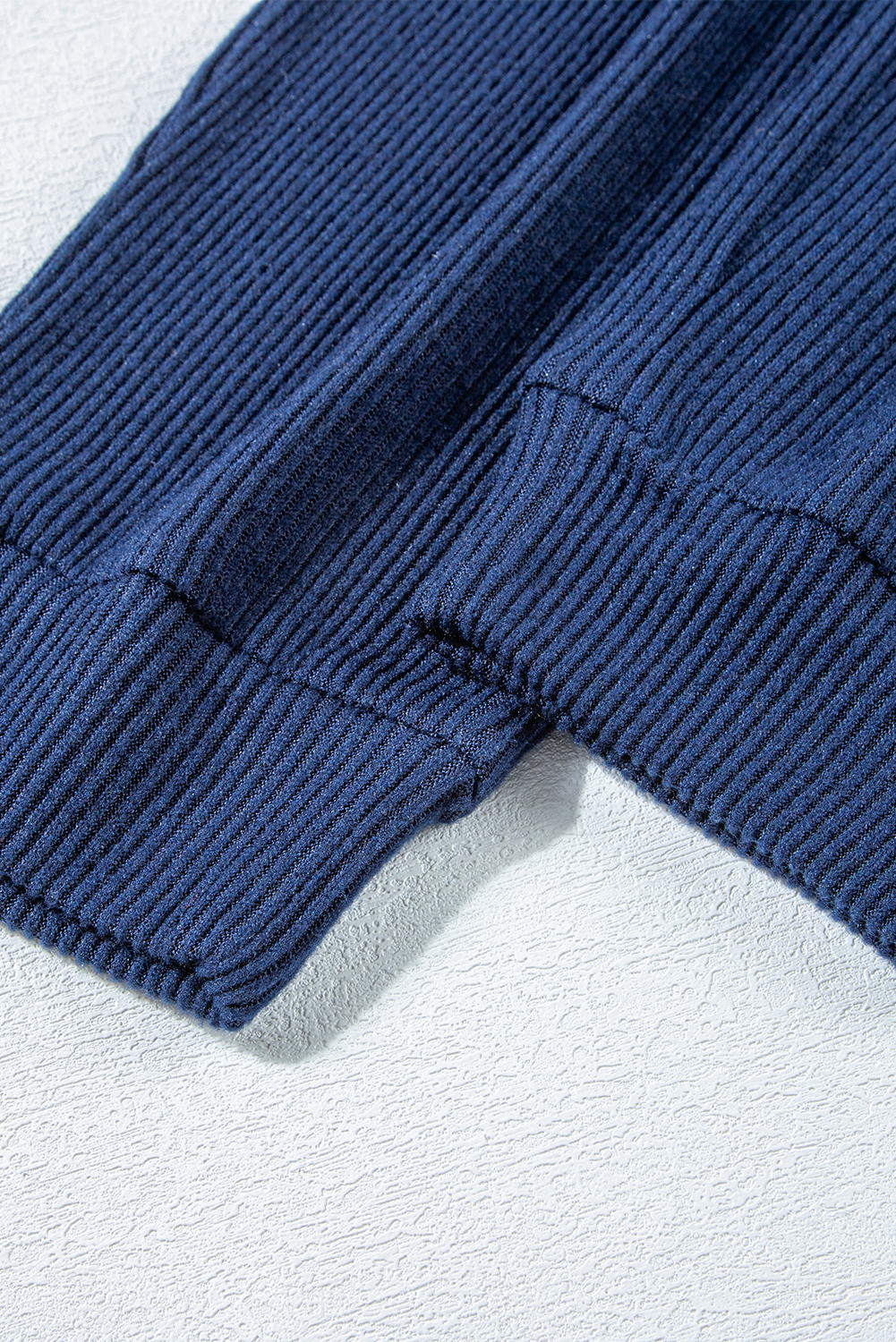 Elevate your activewear collection with this Women's Navy Blue Ribbed Knit Cropped Hoodie and Drawstring Joggers Set. The set includes a cropped hoodie and joggers, offering a coordinated and trendy outfit for your active lifestyle. The stylish ribbed knit design adds a textured look, while the adjustable drawstring on the waist ensures a customized and comfortable fit. Crafted from premium quality fabric, this set provides ultra comfort during workout sessions or casual wear. The hoodie features a hooded neckline and long sleeves, while the joggers come with a high waist and convenient pockets. Versatile and practical, this activewear set is perfect for both workouts and everyday activities. Stay chic and comfortable with this fashionable set in classic navy blue color. - Detail View 24 Elevate your activewear collection with this Women's Navy Blue Ribbed Knit Cropped Hoodie and Drawstring Joggers Set. The set includes a cropped hoodie and joggers, offering a coordinated and trendy outfit for your active lifestyle. The stylish ribbed knit design adds a textured look, while the adjustable drawstring on the waist ensures a customized and comfortable fit. Crafted from premium quality fabric, this set provides ultra comfort during workout sessions or casual wear. The hoodie features a hooded neckline and long sleeves, while the joggers come with a high waist and convenient pockets. Versatile and practical, this activewear set is perfect for both workouts and everyday activities. Stay chic and comfortable with this fashionable set in classic navy blue color. - Detail View 24