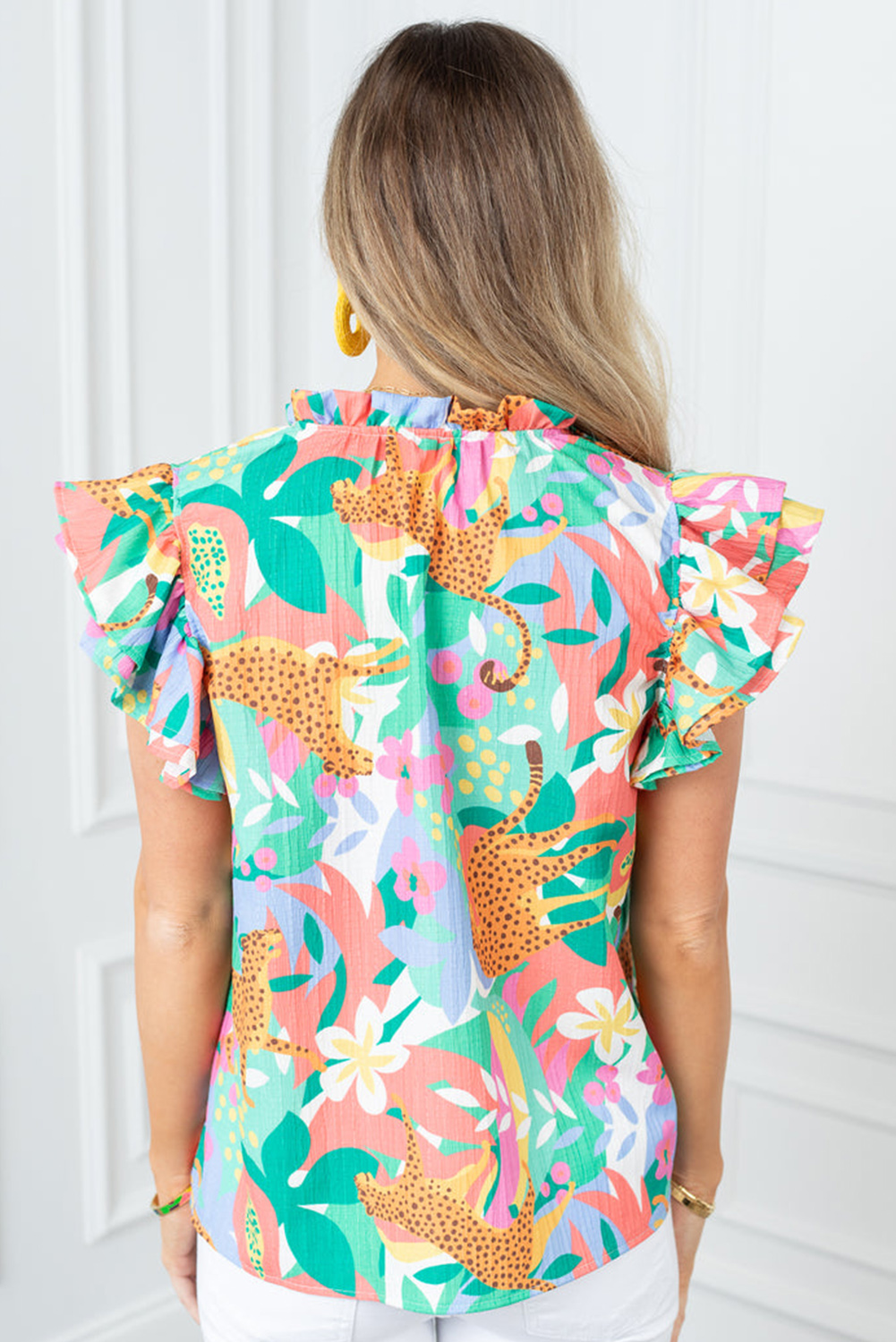 Add a touch of femininity to your summer wardrobe with this Women's Summer Green Frilly Ruffle Tie Split Neck Floral Blouse. The vibrant floral print and stylish frilly tie split neck design exude a playful and chic attitude. The versatile short sleeves with ruffled flutter detail adds a whimsical touch, making it perfect for pairing with jeans, shorts, or skirts. The adorable V-neckline and shift silhouette create a comfortable fit for all body types. Whether you're running errands, meeting friends, or attending a casual summer gathering, this blouse is a must-have addition to your wardrobe. Its lightweight polyester material ensures breathability and ease of wear, perfect for hot summer days. With its fashion-forward design, this blouse is sure to become a summer staple in your wardrobe, featuring delicate cuttings and attractive prices. - Detail View 4 Add a touch of femininity to your summer wardrobe with this Women's Summer Green Frilly Ruffle Tie Split Neck Floral Blouse. The vibrant floral print and stylish frilly tie split neck design exude a playful and chic attitude. The versatile short sleeves with ruffled flutter detail adds a whimsical touch, making it perfect for pairing with jeans, shorts, or skirts. The adorable V-neckline and shift silhouette create a comfortable fit for all body types. Whether you're running errands, meeting friends, or attending a casual summer gathering, this blouse is a must-have addition to your wardrobe. Its lightweight polyester material ensures breathability and ease of wear, perfect for hot summer days. With its fashion-forward design, this blouse is sure to become a summer staple in your wardrobe, featuring delicate cuttings and attractive prices. - Detail View 4