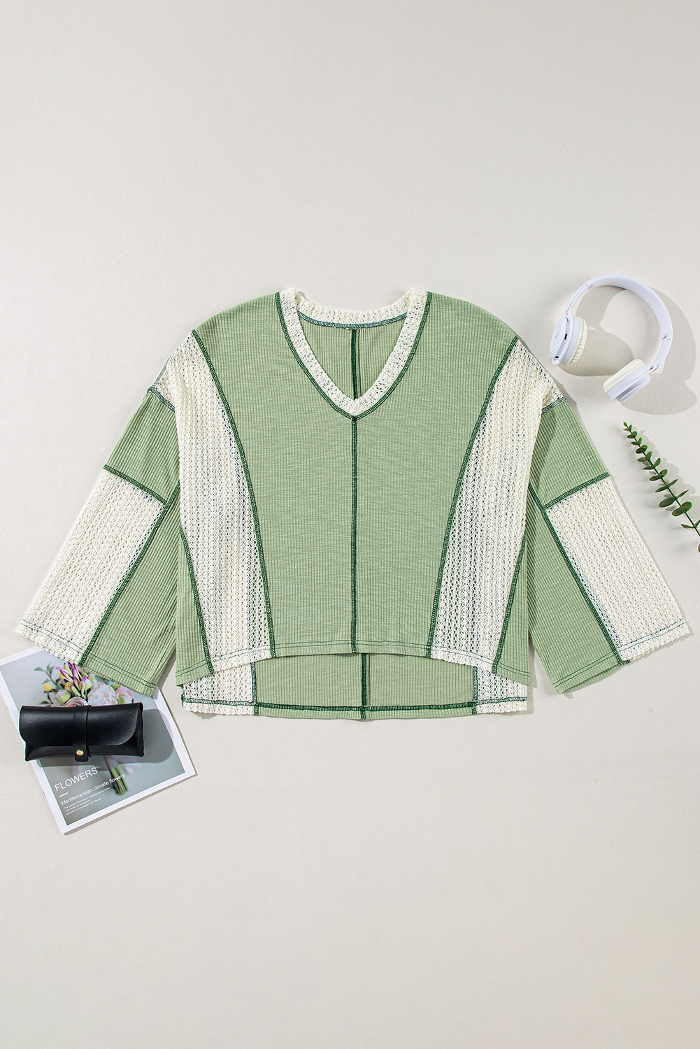 Elevate your wardrobe with this trendy and feminine Women's Grass Green Exposed Seam High Low Loose Fit Crochet Top. Designed in a relaxed fit for a slouchy touch, this knit top features a stylish and vintage appeal with exposed seam and raw hemline. The intricate crochet detail and high low design add a touch of elegance, making it perfect for any body shape to look flattering. This top is friendly and versatile, suitable for daily wear from spring to winter styles. Made from a blend of 60% polyester, 35% cotton, and 5% elastane, this top ensures comfort and softness. Pair it with distressed denim jeans for a chic and causal look, or with a flowy skirt for a more feminine ensemble. This top is a must-have for any woman's wardrobe, offering both style and comfort. - Detail View 4 Elevate your wardrobe with this trendy and feminine Women's Grass Green Exposed Seam High Low Loose Fit Crochet Top. Designed in a relaxed fit for a slouchy touch, this knit top features a stylish and vintage appeal with exposed seam and raw hemline. The intricate crochet detail and high low design add a touch of elegance, making it perfect for any body shape to look flattering. This top is friendly and versatile, suitable for daily wear from spring to winter styles. Made from a blend of 60% polyester, 35% cotton, and 5% elastane, this top ensures comfort and softness. Pair it with distressed denim jeans for a chic and causal look, or with a flowy skirt for a more feminine ensemble. This top is a must-have for any woman's wardrobe, offering both style and comfort. - Detail View 4