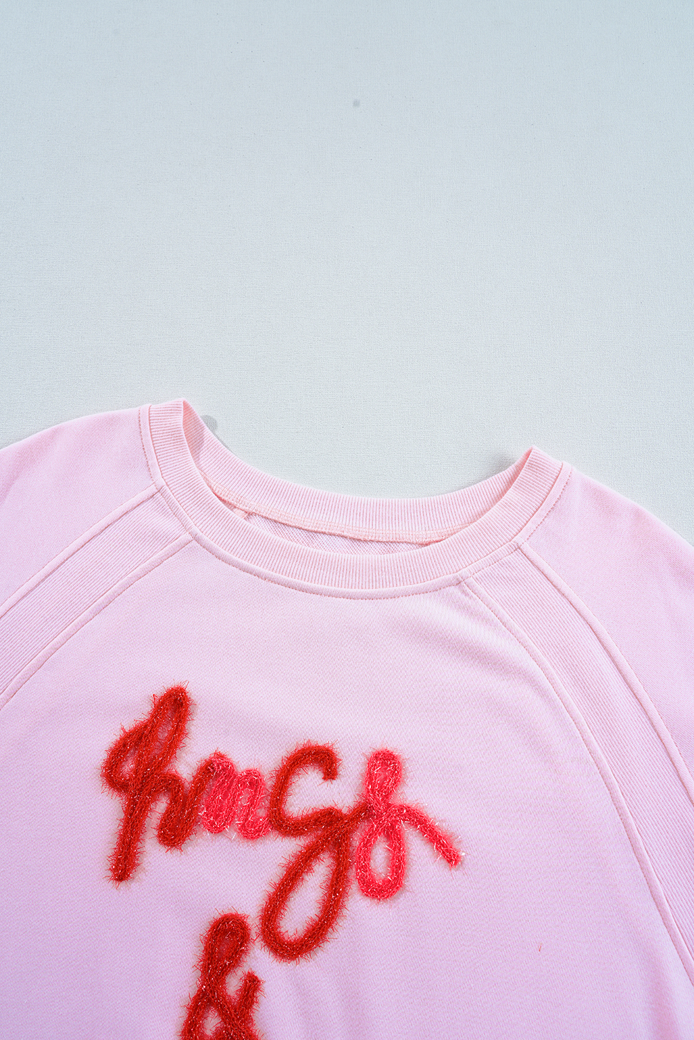 Cozy and Stylish Pink Sweatshirt with Hugs and Kisses Embroidery, Perfect for Daily Wear - Detail View 10 Cozy and Stylish Pink Sweatshirt with Hugs and Kisses Embroidery, Perfect for Daily Wear - Detail View 10