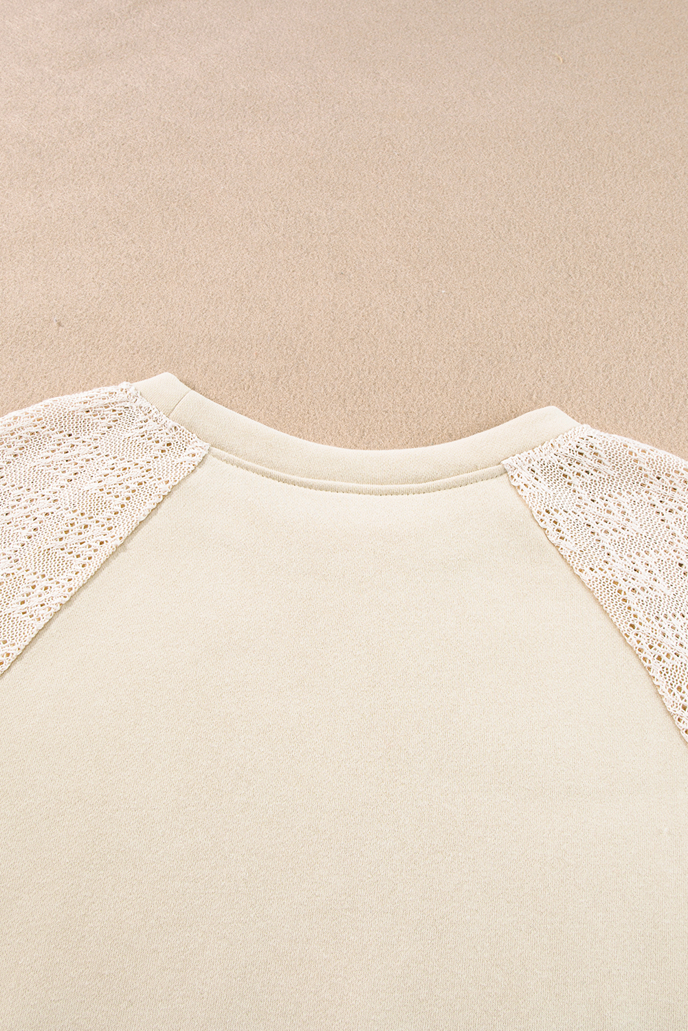 Elevate your casual wardrobe with this timeless and versatile Women's Parchment Eyelet Knit Patchwork Raglan Sleeve Pullover Top. The intricate knit crochet detailing adds a stylish and textured look to the sweatshirt, making it a standout piece in your collection. The raglan sleeves bring a sporty and modern touch, while the flattering regular fit ensures comfort and ease of movement. Made from a premium blend of 50% polyester and 50% cotton, this sweatshirt offers durability and breathability. The solid color and patchwork design make it a contemporary and chic choice for daily wear. Pair it with your favorite jeans or leggings for a trendy and effortless look. This sweatshirt effortlessly elevates your personal style and is a must-have addition to your wardrobe. - Detail View 9 Elevate your casual wardrobe with this timeless and versatile Women's Parchment Eyelet Knit Patchwork Raglan Sleeve Pullover Top. The intricate knit crochet detailing adds a stylish and textured look to the sweatshirt, making it a standout piece in your collection. The raglan sleeves bring a sporty and modern touch, while the flattering regular fit ensures comfort and ease of movement. Made from a premium blend of 50% polyester and 50% cotton, this sweatshirt offers durability and breathability. The solid color and patchwork design make it a contemporary and chic choice for daily wear. Pair it with your favorite jeans or leggings for a trendy and effortless look. This sweatshirt effortlessly elevates your personal style and is a must-have addition to your wardrobe. - Detail View 9