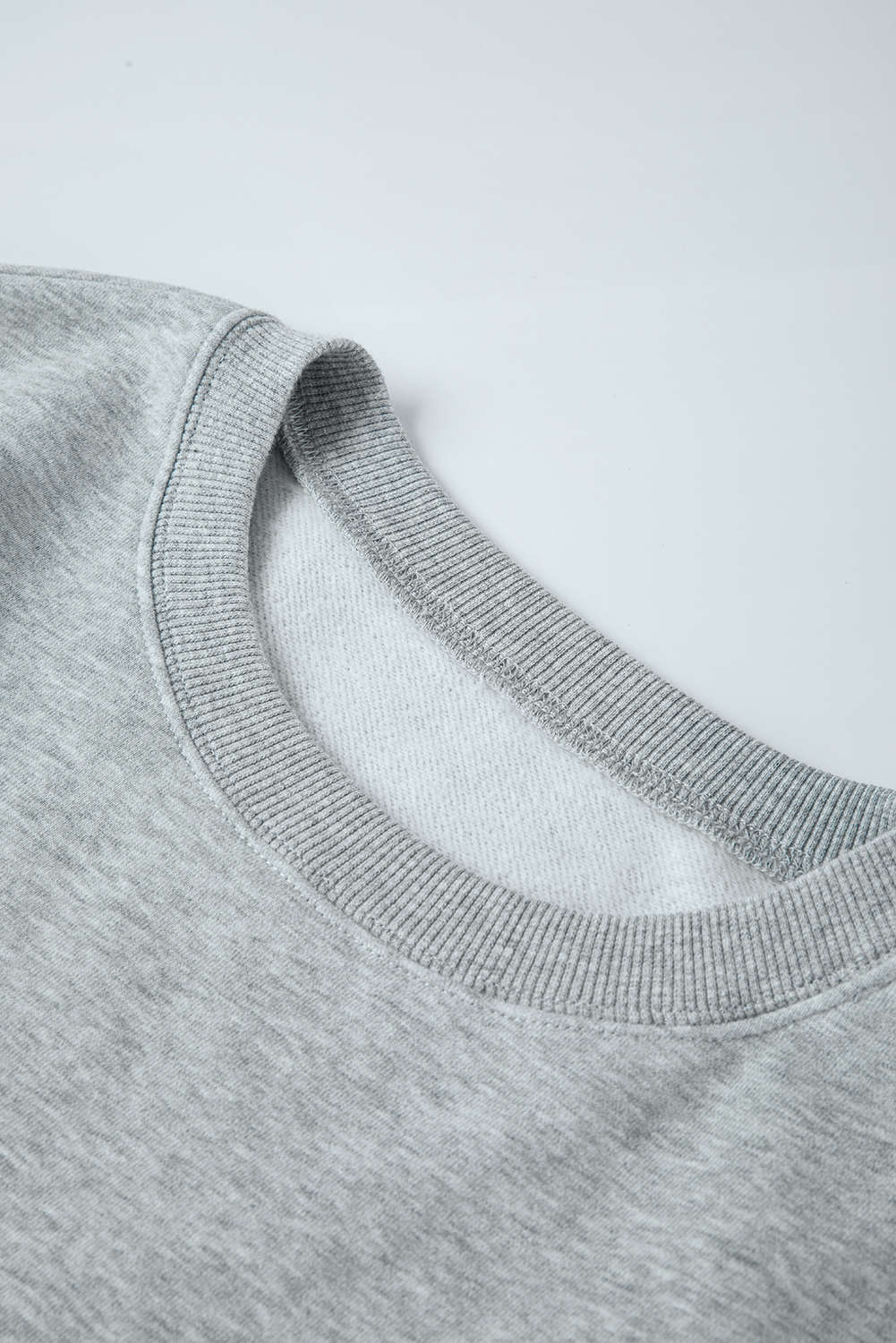 Add a touch of warmth and style to your winter wardrobe with this Women's Light Grey Solid Loose Crew Neck Fleece Sweatshirt. The concise chic style of this sweatshirt exudes effortless charm and versatility. Its loose fit and thigh-high length make it suitable for most silhouettes, offering both comfort and style. The crew neck and drop shoulder design add a casual and relaxed vibe to the sweatshirt, perfect for daily wear. Made with premium 50% polyester and 50% cotton blend, it is very soft and warm, thanks to the fleece lining. This sweatshirt combines fine quality with affordable prices, making it a practical and stylish choice. Stay cozy and fashionable during the winter season with this basic yet trendy oversized sweatshirt in a beautiful light grey color. - Detail View 9 Add a touch of warmth and style to your winter wardrobe with this Women's Light Grey Solid Loose Crew Neck Fleece Sweatshirt. The concise chic style of this sweatshirt exudes effortless charm and versatility. Its loose fit and thigh-high length make it suitable for most silhouettes, offering both comfort and style. The crew neck and drop shoulder design add a casual and relaxed vibe to the sweatshirt, perfect for daily wear. Made with premium 50% polyester and 50% cotton blend, it is very soft and warm, thanks to the fleece lining. This sweatshirt combines fine quality with affordable prices, making it a practical and stylish choice. Stay cozy and fashionable during the winter season with this basic yet trendy oversized sweatshirt in a beautiful light grey color. - Detail View 9