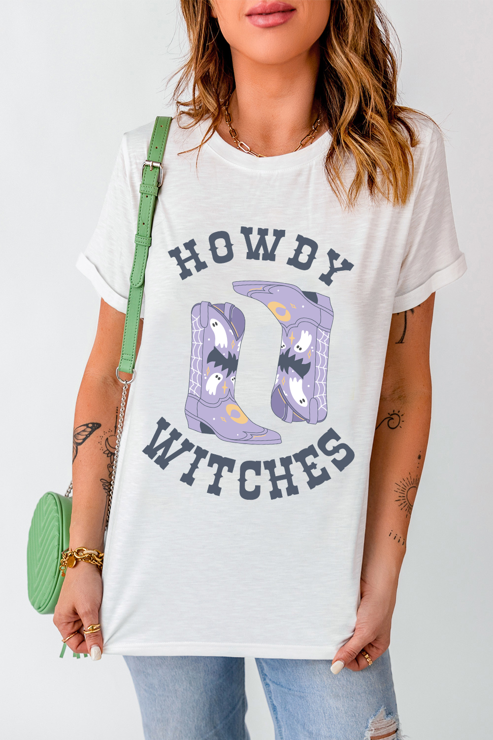 Make a statement with this bold and unique HOWDY WITCHES graphic t-shirt. The classic crew neck design and short sleeves ensure comfort and casual wear, perfect for warm weather. The stunning holidays graphic is sure to stand out and add a touch of whimsy to your outfit. This t-shirt is a must-have for Halloween festivities and summer wear. Pair it with your favorite jeans or shorts for a stylish and effortless look. Graphic tees offer a variety of options to express your personality, making this a great addition to your wardrobe. - Detail View 9 Make a statement with this bold and unique HOWDY WITCHES graphic t-shirt. The classic crew neck design and short sleeves ensure comfort and casual wear, perfect for warm weather. The stunning holidays graphic is sure to stand out and add a touch of whimsy to your outfit. This t-shirt is a must-have for Halloween festivities and summer wear. Pair it with your favorite jeans or shorts for a stylish and effortless look. Graphic tees offer a variety of options to express your personality, making this a great addition to your wardrobe. - Detail View 9