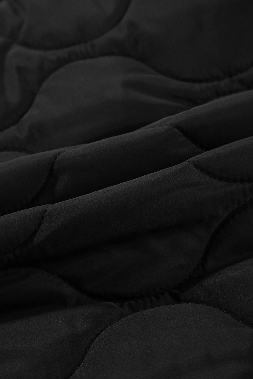 Stay cozy and stylish in the colder months with this Women's Black Quilted Hooded Zip-Up Puffer Vest. The premium quilted design adds a chic and fashionable look to the vest, while the convenient zip-up front ensures easy wear. The hooded design and drawstring provide extra warmth and style, making it a versatile and practical choice for the winter season. Made from 100% polyester, this vest offers both comfort and durability. The sleeveless silhouette allows for layering over your favorite long sleeve tops or sweaters. Perfect for daily wear and casual occasions, this black puffer vest is a must-have addition to your winter wardrobe. - Detail View 9 Stay cozy and stylish in the colder months with this Women's Black Quilted Hooded Zip-Up Puffer Vest. The premium quilted design adds a chic and fashionable look to the vest, while the convenient zip-up front ensures easy wear. The hooded design and drawstring provide extra warmth and style, making it a versatile and practical choice for the winter season. Made from 100% polyester, this vest offers both comfort and durability. The sleeveless silhouette allows for layering over your favorite long sleeve tops or sweaters. Perfect for daily wear and casual occasions, this black puffer vest is a must-have addition to your winter wardrobe. - Detail View 9