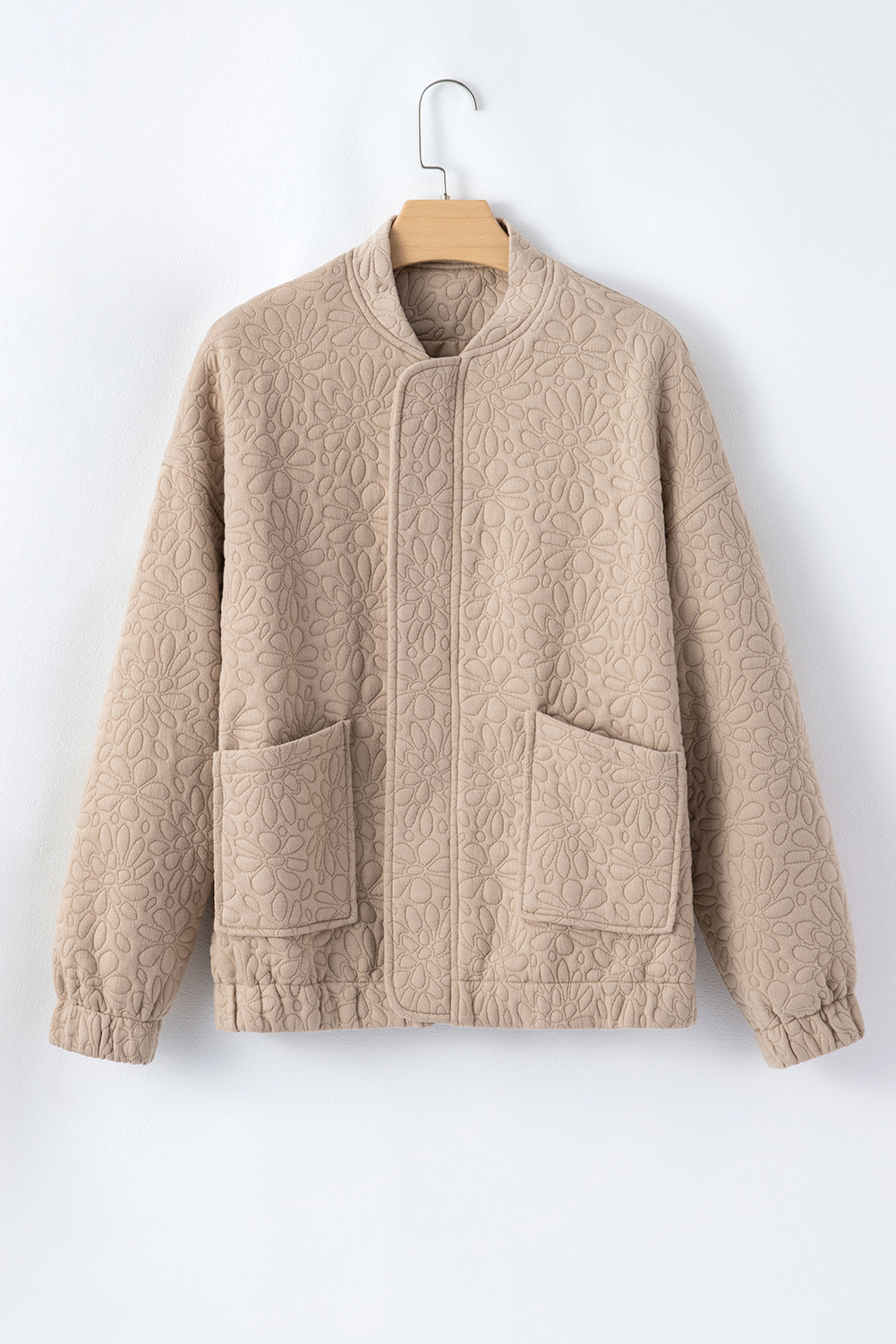 Add a touch of elegance to your wardrobe with this Women's Light French Beige Floral Quilted Jacket. The quilted fabric features a stunning floral design, making it a standout piece for any occasion. The long sleeves and drop shoulders create a comfortable and relaxed fit, while the full-zipped closure ensures a secure and warm wear. This stylish jacket is perfect for daily wear, and its solid color makes it easy to pair with your favorite outfits. The quited design and floral pattern add a touch of whimsy and playfulness, making it a great addition to your winter wardrobe. Whether you're running errands or meeting friends, this jacket is sure to turn heads. - Detail View 14 Add a touch of elegance to your wardrobe with this Women's Light French Beige Floral Quilted Jacket. The quilted fabric features a stunning floral design, making it a standout piece for any occasion. The long sleeves and drop shoulders create a comfortable and relaxed fit, while the full-zipped closure ensures a secure and warm wear. This stylish jacket is perfect for daily wear, and its solid color makes it easy to pair with your favorite outfits. The quited design and floral pattern add a touch of whimsy and playfulness, making it a great addition to your winter wardrobe. Whether you're running errands or meeting friends, this jacket is sure to turn heads. - Detail View 14