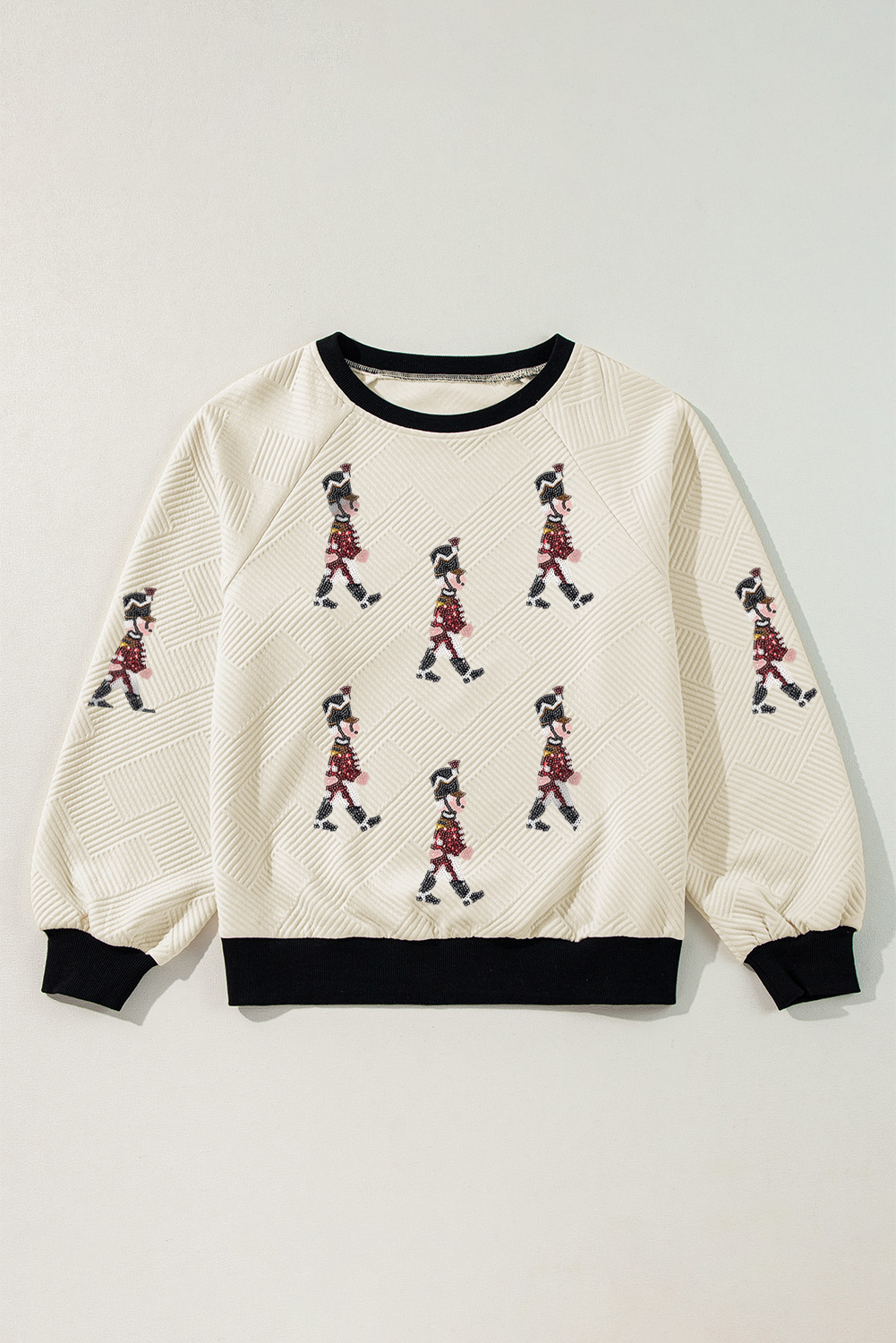 Festive Graphic Long Sleeve Tee with Shimmering Nutcracker Patches and Colorblock Design - Detail View 6 Festive Graphic Long Sleeve Tee with Shimmering Nutcracker Patches and Colorblock Design - Detail View 6