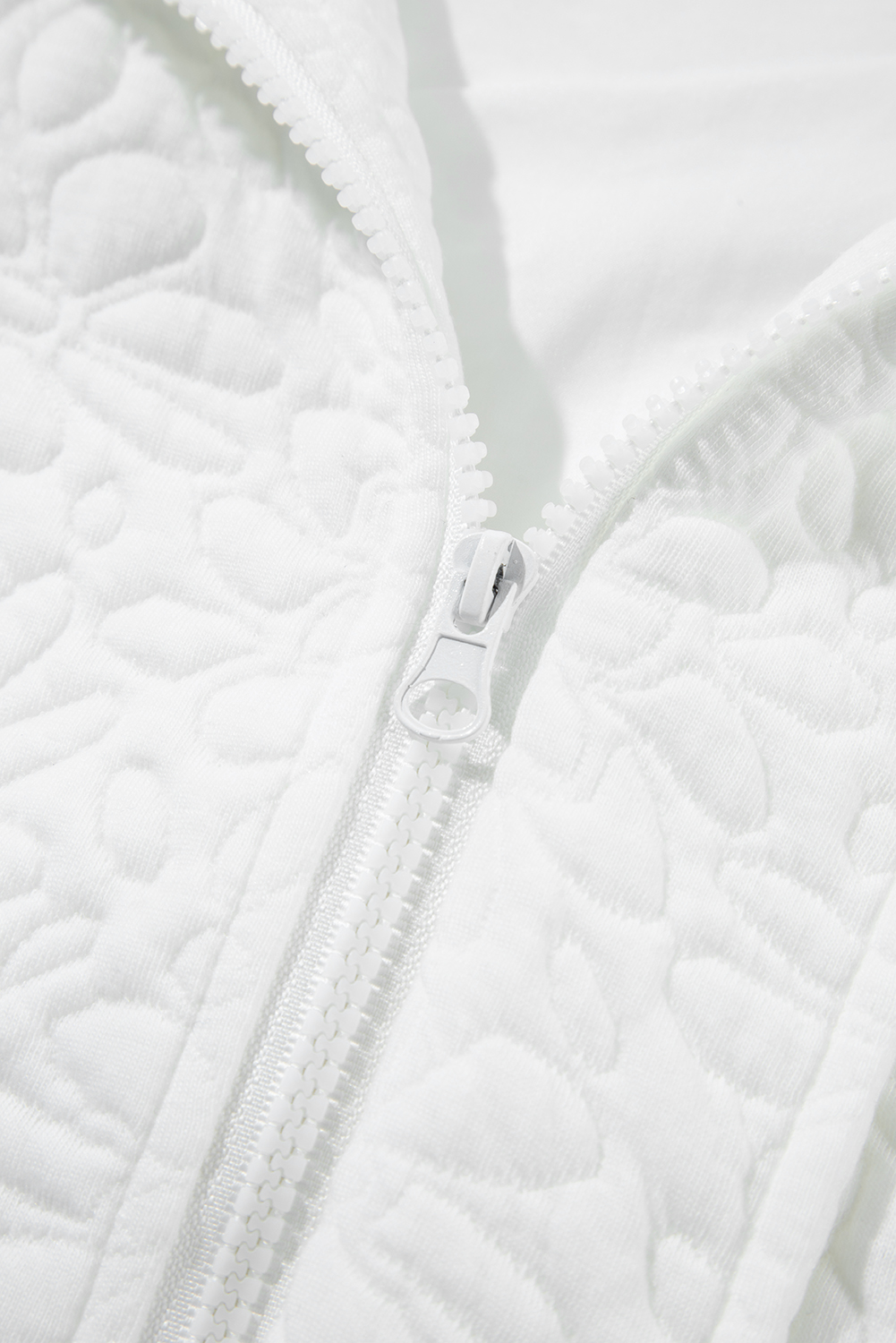 Stay stylish and warm with this Women's White Floral Quilted Long Sleeve Jacket. Featuring a woven quilted fabric in a beautiful floral design, this jacket exudes a modern and chic look. The long sleeves and drop shoulders provide a comfortable fit, while the full zipped closure on the front ensures a secure and adjustable fit. Made from a durable 97% polyester and 3% elastane blend, this jacket is both practical and stylish. The solid white color makes it easy to pair with your favorite outfits, and its concise and versatile design makes it suitable for daily wear during the winter season. This jacket is a must-have for your winter wardrobe, featuring the latest fashion trend in quilted jackets. - Detail View 19 Stay stylish and warm with this Women's White Floral Quilted Long Sleeve Jacket. Featuring a woven quilted fabric in a beautiful floral design, this jacket exudes a modern and chic look. The long sleeves and drop shoulders provide a comfortable fit, while the full zipped closure on the front ensures a secure and adjustable fit. Made from a durable 97% polyester and 3% elastane blend, this jacket is both practical and stylish. The solid white color makes it easy to pair with your favorite outfits, and its concise and versatile design makes it suitable for daily wear during the winter season. This jacket is a must-have for your winter wardrobe, featuring the latest fashion trend in quilted jackets. - Detail View 19