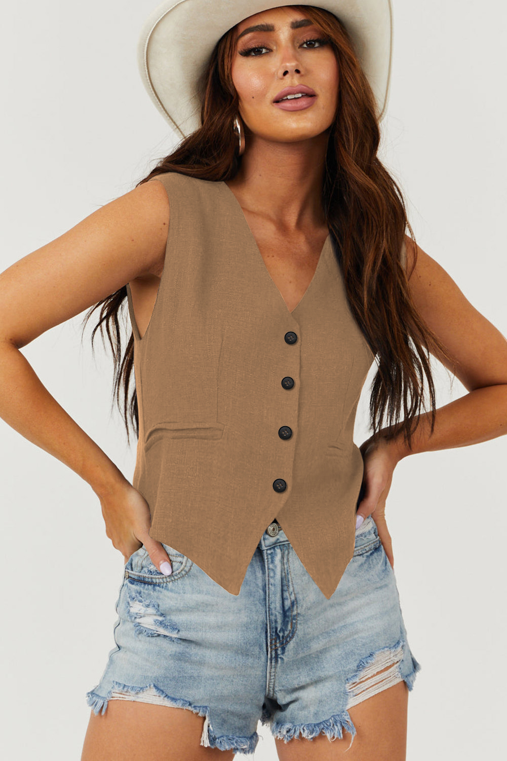Elevate your style and add a touch of sophistication with this Women's Chestnut Solid Color V Neck Suit Vest. Perfect for layering, this classic solid color vest features a timeless and versatile design that can be dressed up or down. The V neckline adds a touch of elegance to your outfit, while the button closure provides a polished and adjustable fit. With a versatile style for your wardrobe update, this vest is a must-have for your fashion collection. Made from a blend of 85% polyester, 10% viscose, and 5% elastane, this vest ensures durability and comfort. Pair it with a blouse, dress, or even a top for a chic and modern look. - Detail View 4 Elevate your style and add a touch of sophistication with this Women's Chestnut Solid Color V Neck Suit Vest. Perfect for layering, this classic solid color vest features a timeless and versatile design that can be dressed up or down. The V neckline adds a touch of elegance to your outfit, while the button closure provides a polished and adjustable fit. With a versatile style for your wardrobe update, this vest is a must-have for your fashion collection. Made from a blend of 85% polyester, 10% viscose, and 5% elastane, this vest ensures durability and comfort. Pair it with a blouse, dress, or even a top for a chic and modern look. - Detail View 4