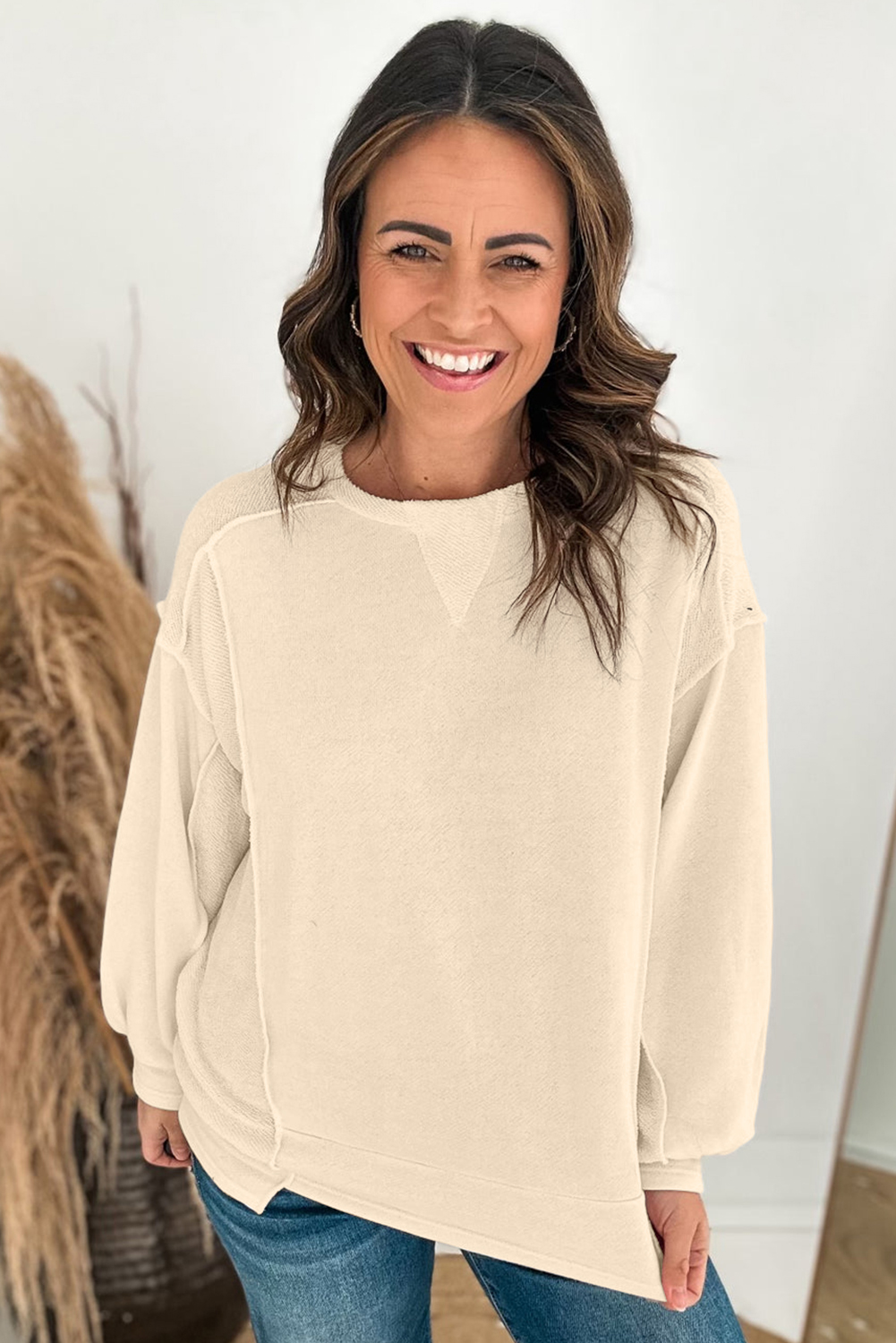 Stay warm and stylish all year round with this Women's Beige Splicing Round Neck Pullover Sweatshirt. The plain design offers a sleek and polished look, while the round neck and relaxed fit create a timeless silhouette. The splicing details add a touch of uniqueness to the solid beige color, making this sweatshirt a fashionable choice for daily wear. The pullover style ensures ease of wear, and the soft and warm material ensures comfortable wear. This sweatshirt is a must-have addition to your wardrobe, perfect for casual fall and autumn wear. - Detail View 4 Stay warm and stylish all year round with this Women's Beige Splicing Round Neck Pullover Sweatshirt. The plain design offers a sleek and polished look, while the round neck and relaxed fit create a timeless silhouette. The splicing details add a touch of uniqueness to the solid beige color, making this sweatshirt a fashionable choice for daily wear. The pullover style ensures ease of wear, and the soft and warm material ensures comfortable wear. This sweatshirt is a must-have addition to your wardrobe, perfect for casual fall and autumn wear. - Detail View 4