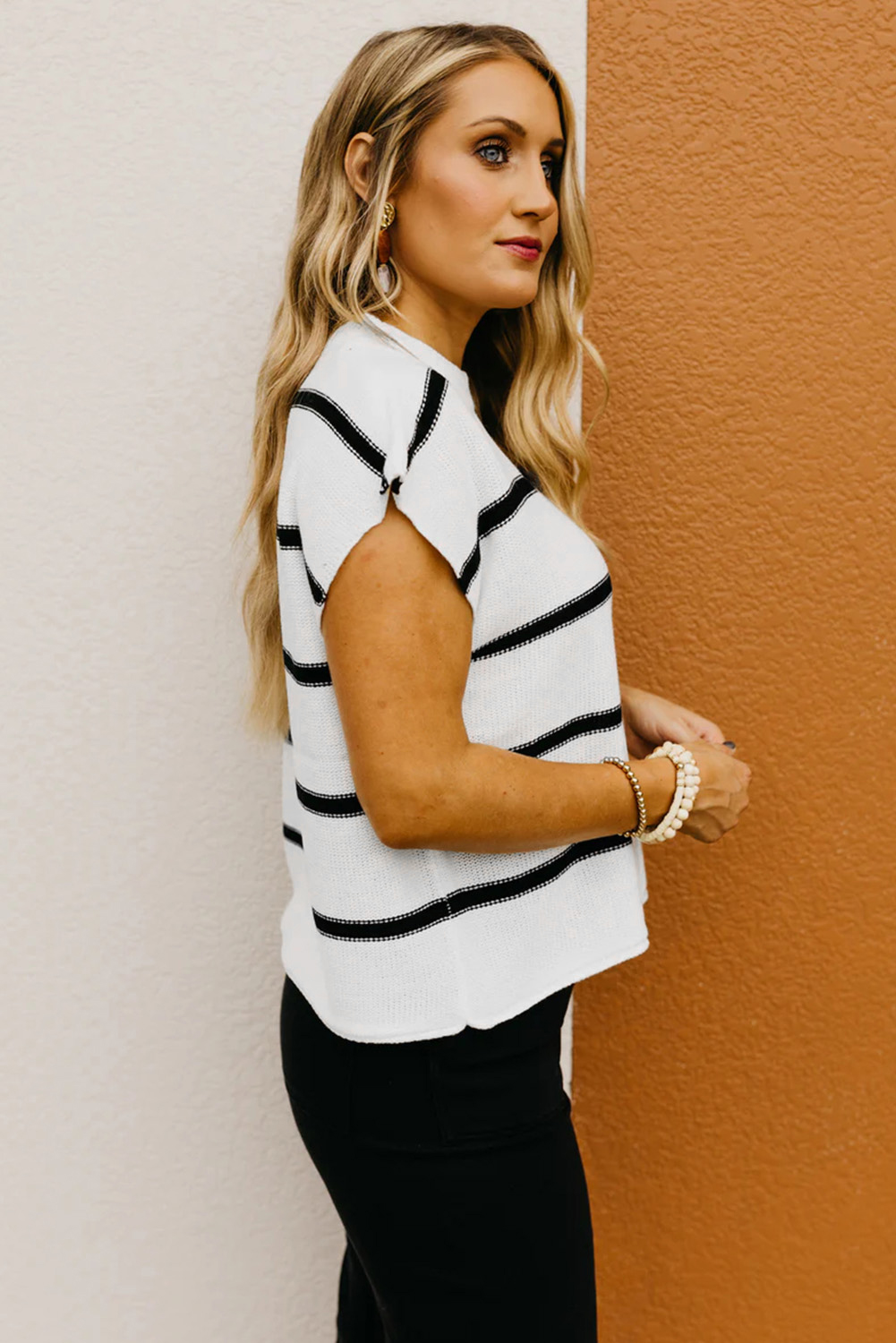 Elevate your casual wardrobe with this classic and fashionable Women's White Striped Batwing Sleeve Sweater Tee. The striped style, crew neck, and batwing sleeves give this tee a stylish and modern look, perfect for everyday wear. The loose fit provides comfort and ease of movement, while the soft and breathable 100% acrylic material ensures cozy wearing all day long. This versatile sweater tee pairs well with jeans, skirts, and shorts, making it a must-have addition to your collection. Stay on-trend and comfortable with the latest fashion from Clothes. - Detail View 4 Elevate your casual wardrobe with this classic and fashionable Women's White Striped Batwing Sleeve Sweater Tee. The striped style, crew neck, and batwing sleeves give this tee a stylish and modern look, perfect for everyday wear. The loose fit provides comfort and ease of movement, while the soft and breathable 100% acrylic material ensures cozy wearing all day long. This versatile sweater tee pairs well with jeans, skirts, and shorts, making it a must-have addition to your collection. Stay on-trend and comfortable with the latest fashion from Clothes. - Detail View 4