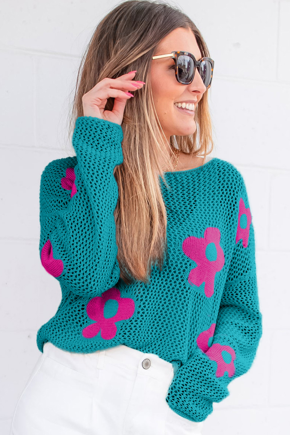 Stay stylish and comfortable all year round with this Women's Sea Green Floral Hollowed Knit Drop Shoulder Sweater. The flower hollowed knit design is a popular trend this season, adding a touch of femininity to your daily looks. The long sleeves and relaxed fit make it perfect for casual daily wear, while the open knit keeps you cool on hot days. Pair it with your favorite jeans or skirts for a chic and effortless look. Made from a soft blend of 55% acrylic and 45% cotton, this sweater ensures a comfortable fit. The sea green color is a beautiful and calming shade, perfect for spring and summer days. With its unique cut-out details, this sweater is a must-have addition to your wardrobe. - Detail View 4 Stay stylish and comfortable all year round with this Women's Sea Green Floral Hollowed Knit Drop Shoulder Sweater. The flower hollowed knit design is a popular trend this season, adding a touch of femininity to your daily looks. The long sleeves and relaxed fit make it perfect for casual daily wear, while the open knit keeps you cool on hot days. Pair it with your favorite jeans or skirts for a chic and effortless look. Made from a soft blend of 55% acrylic and 45% cotton, this sweater ensures a comfortable fit. The sea green color is a beautiful and calming shade, perfect for spring and summer days. With its unique cut-out details, this sweater is a must-have addition to your wardrobe. - Detail View 4