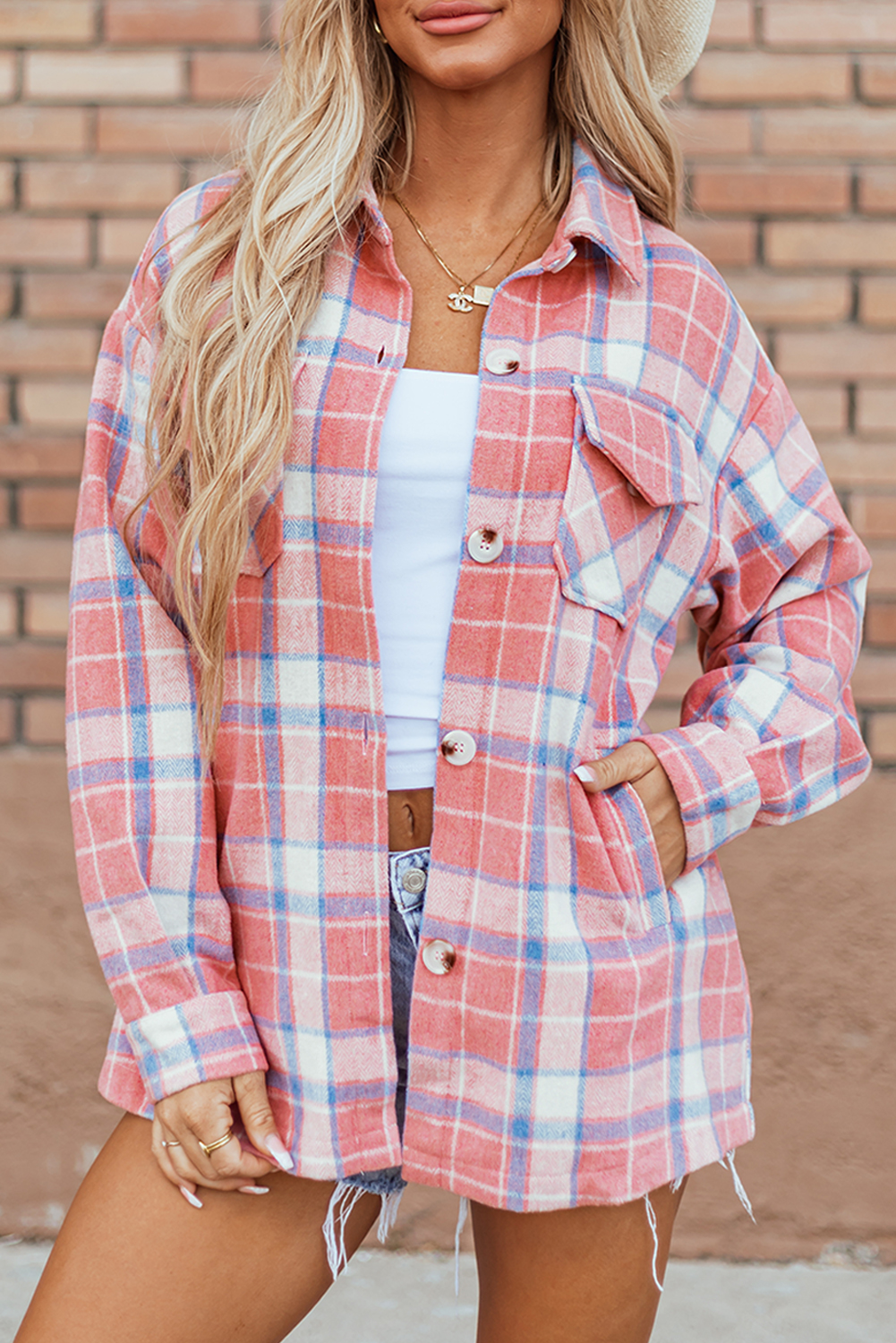 Stay stylish and comfortable in the early autumn with this Women's Pink Plaid Flap Pocket Button Up Shacket. The classic plaid design adds a touch of timeless charm to your outfit, while the convenient flap pockets provide storage for your essentials. Made from premium 100% polyester, this shacket is lightweight yet provides an extra layer of warmth for cool days. The versatile button-up style allows you to create a casual yet put-together look effortlessly. The pink color adds a feminine and chic touch to the shacket, making it an ideal choice for the fall and autumn season. Pair it with jeans and boots for a trendy and cozy ensemble. This shacket is a must-have addition to your daily wardrobe, offering both style and functionality. - Detail View 9 Stay stylish and comfortable in the early autumn with this Women's Pink Plaid Flap Pocket Button Up Shacket. The classic plaid design adds a touch of timeless charm to your outfit, while the convenient flap pockets provide storage for your essentials. Made from premium 100% polyester, this shacket is lightweight yet provides an extra layer of warmth for cool days. The versatile button-up style allows you to create a casual yet put-together look effortlessly. The pink color adds a feminine and chic touch to the shacket, making it an ideal choice for the fall and autumn season. Pair it with jeans and boots for a trendy and cozy ensemble. This shacket is a must-have addition to your daily wardrobe, offering both style and functionality. - Detail View 9