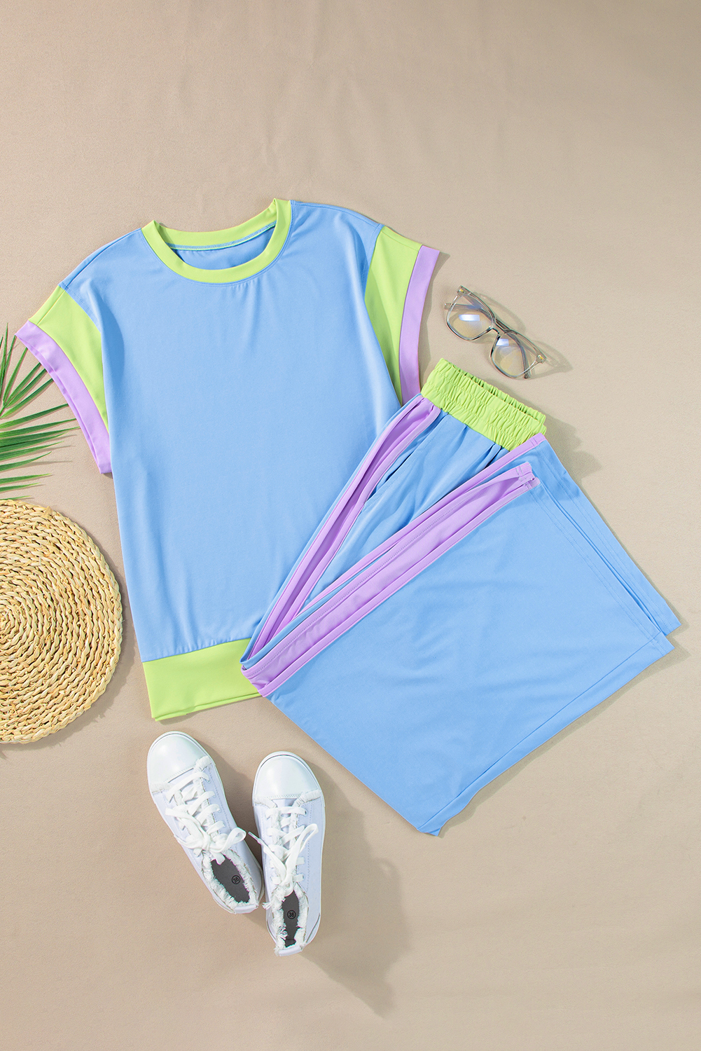Elevate your casual wardrobe with this chic and trendy Women's Sky Blue Color Block Two-Piece Casual Outfit. The eye-catching color block detail makes this solid two-piece set a fashionable choice for the summer season. The set includes a crew neck cap sleeve tee and crop wide leg pants, offering a loose fit and friendly design suitable for most body shapes. Crafted from fine fabric, this outfit is stylish and comfortable, perfect for warm weather. The high-quality material ensures durability and breathability, making it a must-have for your daily wear collection. This trendy set is ideal for various occasions and is a hot seller in the world of casual styles. Embrace the summer vibes with this stylish and comfy two-piece outfit in sky blue! - Detail View 9 Elevate your casual wardrobe with this chic and trendy Women's Sky Blue Color Block Two-Piece Casual Outfit. The eye-catching color block detail makes this solid two-piece set a fashionable choice for the summer season. The set includes a crew neck cap sleeve tee and crop wide leg pants, offering a loose fit and friendly design suitable for most body shapes. Crafted from fine fabric, this outfit is stylish and comfortable, perfect for warm weather. The high-quality material ensures durability and breathability, making it a must-have for your daily wear collection. This trendy set is ideal for various occasions and is a hot seller in the world of casual styles. Embrace the summer vibes with this stylish and comfy two-piece outfit in sky blue! - Detail View 9
