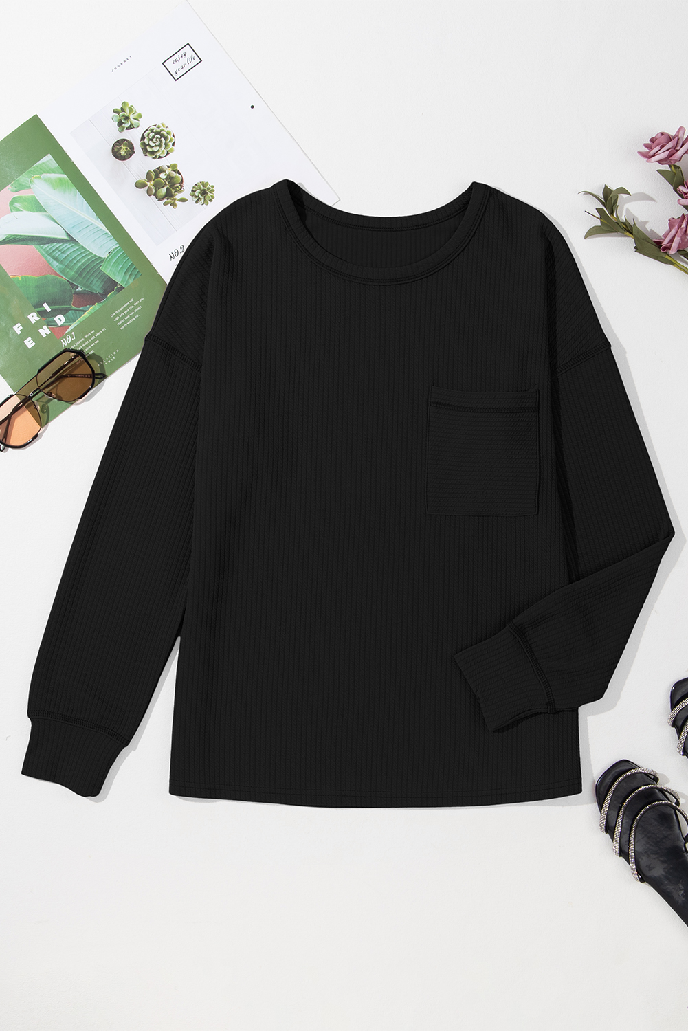 Add a touch of versatility and style to your wardrobe with this Women's Black Corded Drop Shoulder Long Sleeve Top. The solid black color offers a timeless and easy-to-style piece, suitable for various occasions. The corded detailing adds a textured and unique aesthetic to the top, giving it a fashionable edge. Designed with long sleeves for added coverage and warmth, this top is perfect for the fall and autumn seasons. The drop shoulder design creates a relaxed and trendy silhouette, enhancing your personal style effortlessly. Made from a blend of 95% polyester and 5% elastane, this top ensures comfort and durability. The round neckline adds a classic touch to the overall look. Pair this casual long sleeve top with your favorite jeans or leggings for a chic and comfortable outfit. - Detail View 4 Add a touch of versatility and style to your wardrobe with this Women's Black Corded Drop Shoulder Long Sleeve Top. The solid black color offers a timeless and easy-to-style piece, suitable for various occasions. The corded detailing adds a textured and unique aesthetic to the top, giving it a fashionable edge. Designed with long sleeves for added coverage and warmth, this top is perfect for the fall and autumn seasons. The drop shoulder design creates a relaxed and trendy silhouette, enhancing your personal style effortlessly. Made from a blend of 95% polyester and 5% elastane, this top ensures comfort and durability. The round neckline adds a classic touch to the overall look. Pair this casual long sleeve top with your favorite jeans or leggings for a chic and comfortable outfit. - Detail View 4